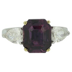 4.67 Carat Violet Sapphire 
Diamond Three-Stone Ring