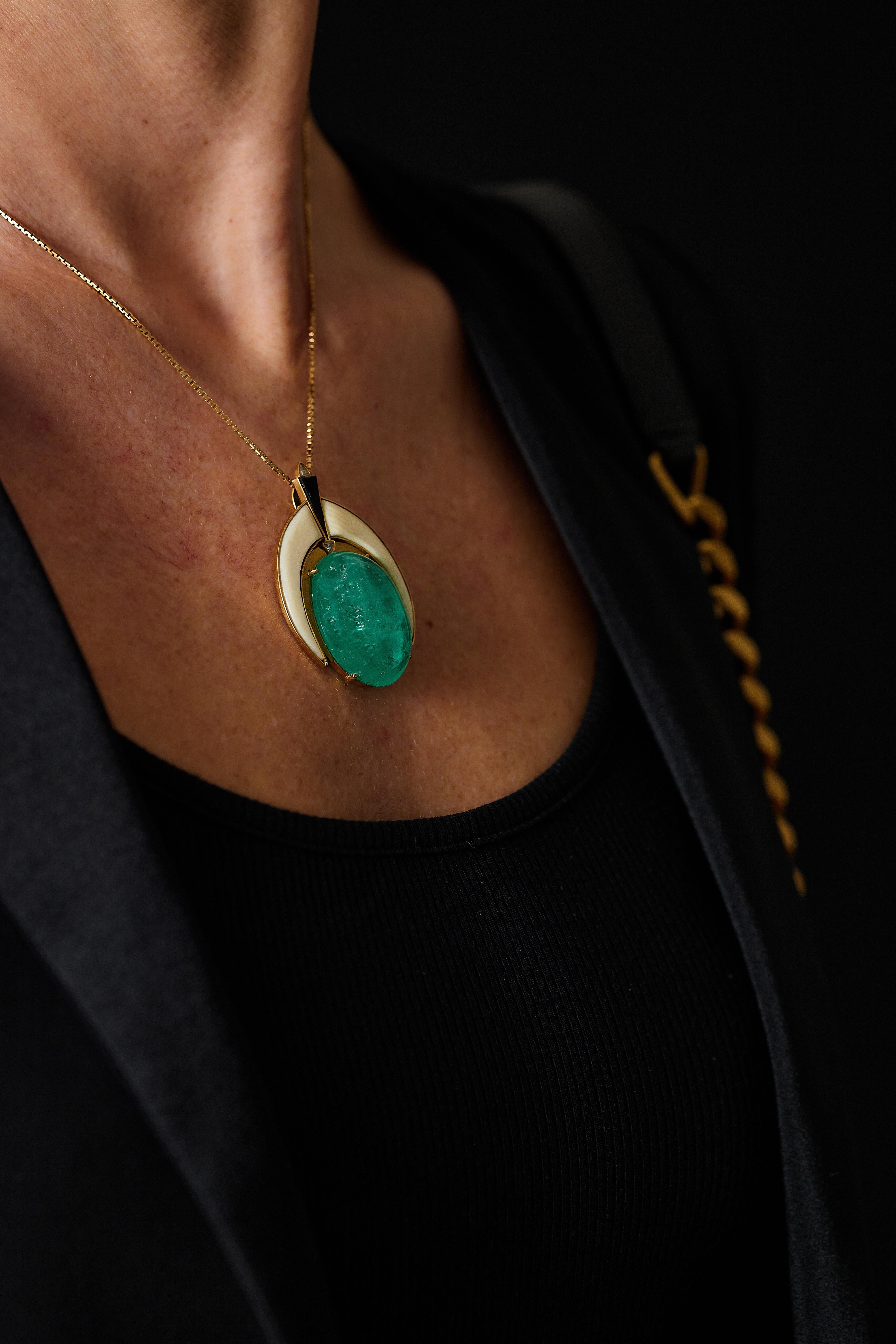 Cabochon 46.7 ct emerald art deco pendant.