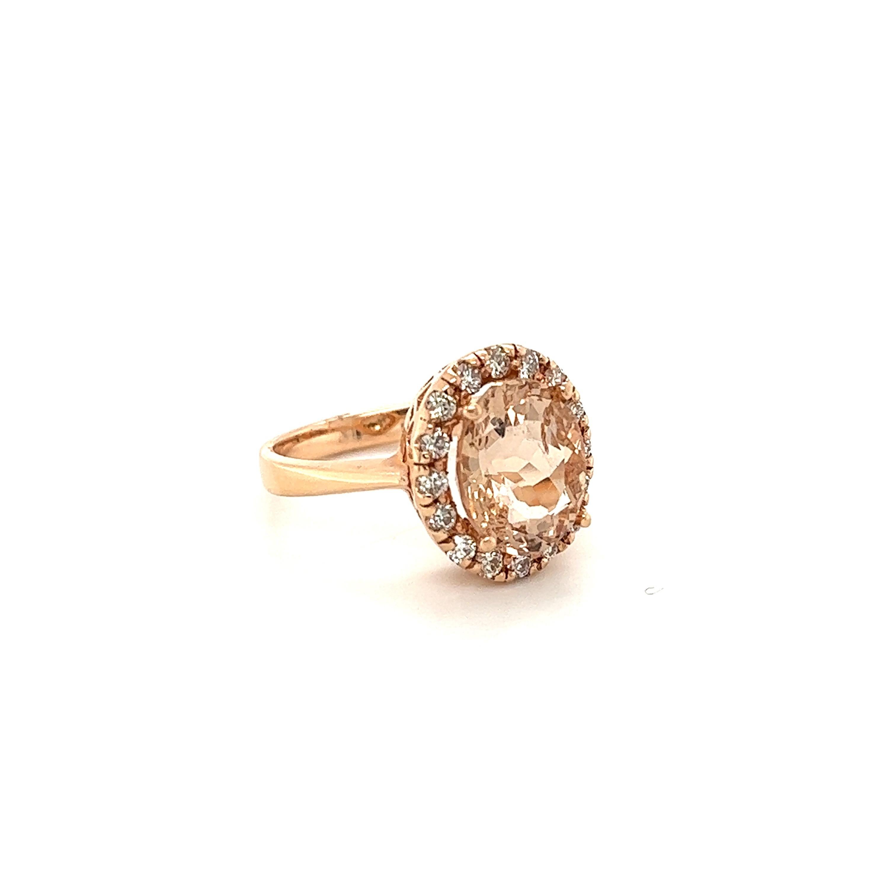 This Morganite ring has a beautiful 4.19 Carat Natural Oval Cut Morganite and is surrounded by a simple halo of  16 Round Cut Diamonds that weigh 0.49 Carats. The diamonds have a clarity and color of VS-H. The total carat weight of the ring is 4.68