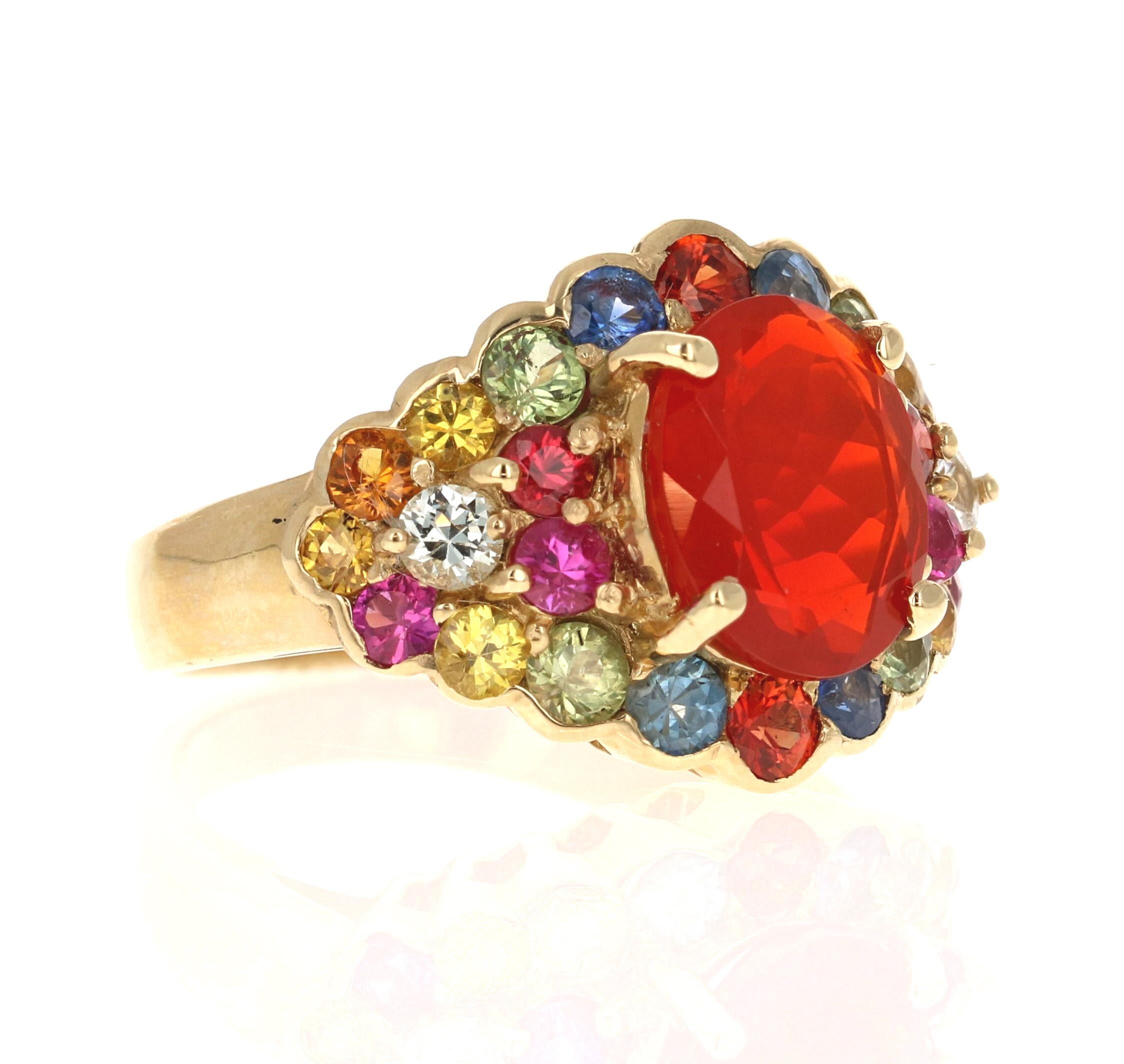 4.68 Carat Oval Cut Fire Opal Sapphire 14 Karat Yellow Gold Cocktail Ring

This ring has a 1.99 Carat Oval Cut Fire Opal as its center stone and is elegantly surrounded by 24 Round Cut Multi-Colored Sapphires that weigh 2.69 Carats. The measurements