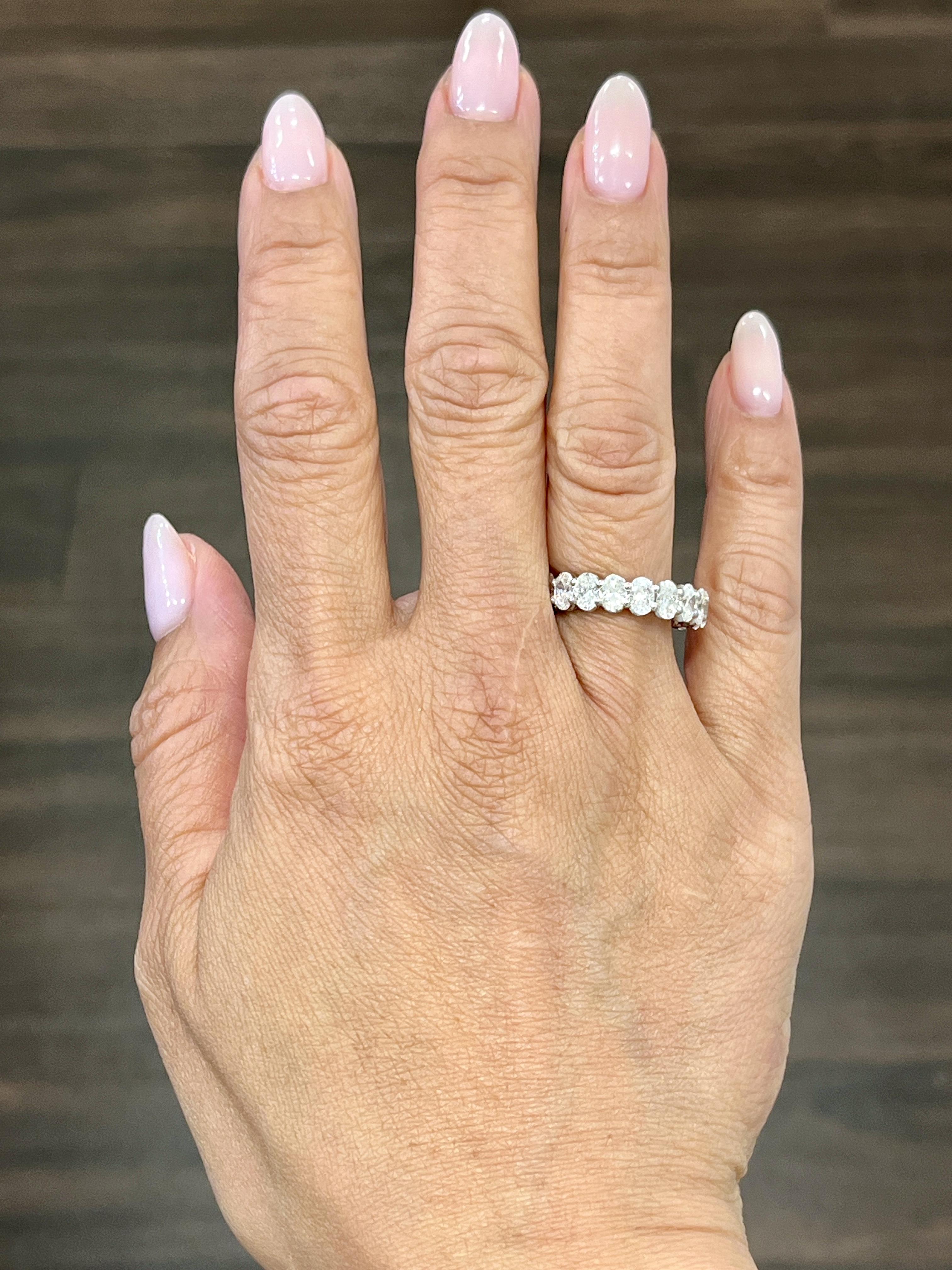 This gorgeous eternity ring features 19 ovals encased in platinum. The diamonds boast a color of F/G and VS1/VS2 in clarity. Such a gorgeous ring to add to any wardrobe.