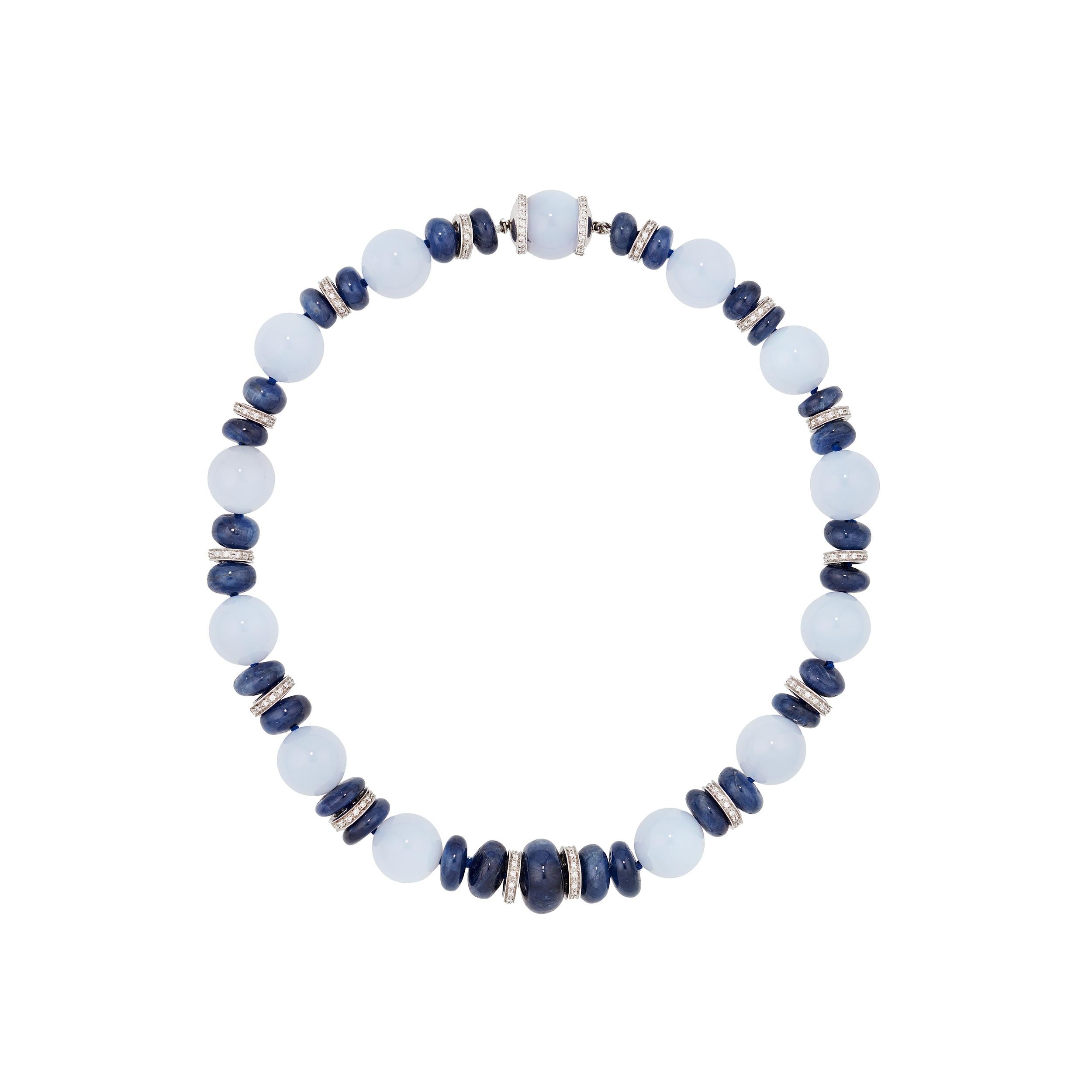 This choker necklace emanates light with glowing Chalcedony set off by Blue Sapphire and 18 Karat White Gold and Diamond Roundels.  The clasp is expertly hidden and flows effortlessly with the rest of the necklace.

This necklace has coordinating