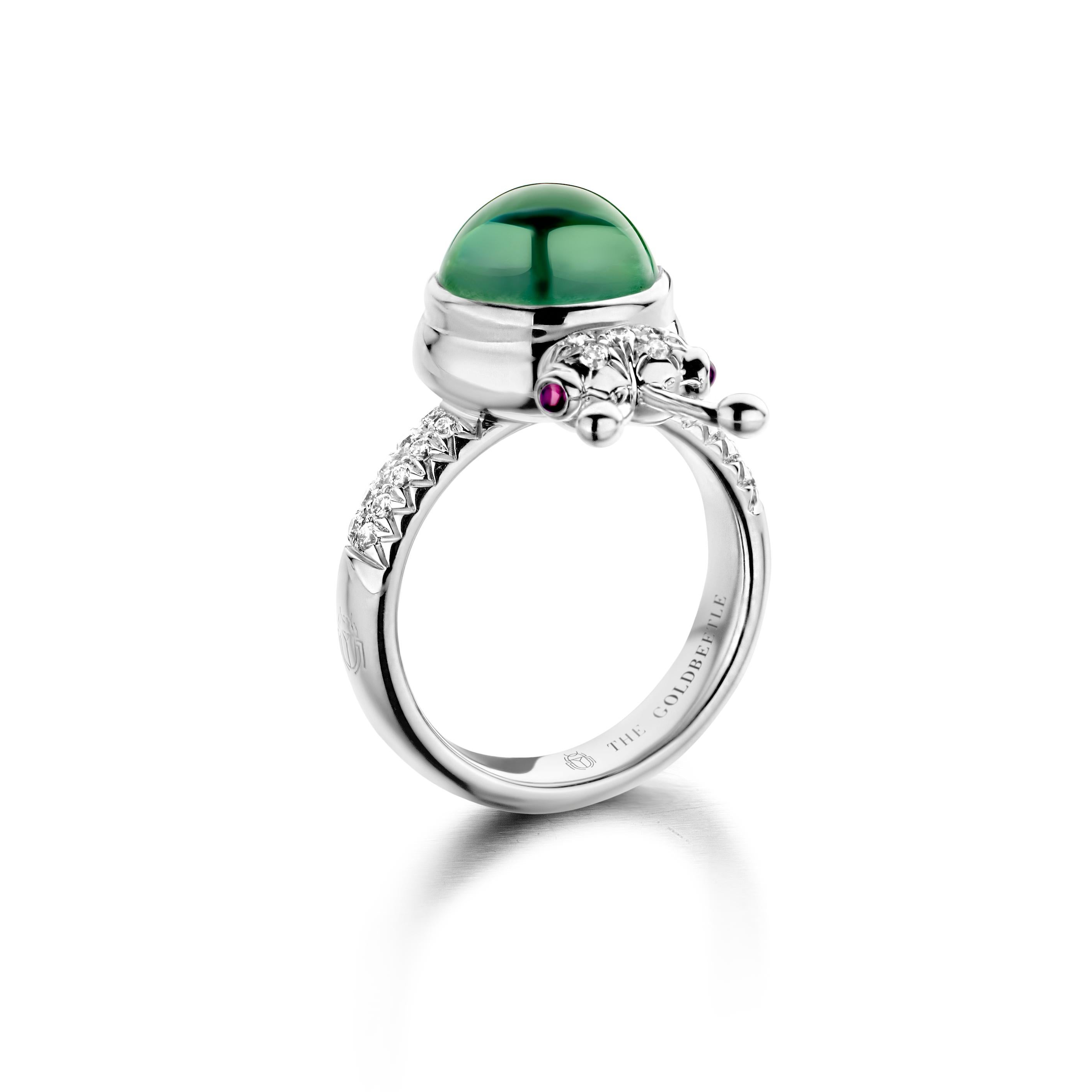 One of a kind lucky beetle ring in 18K white gold 10g set with the finest diamonds in brilliant cut 0,23Ct (VVS/DEF quality) one natural, mint tourmaline in round cabochon cut 4,69Ct and two pink tourmalines in round cabochon cut. 

Celine Roelens,