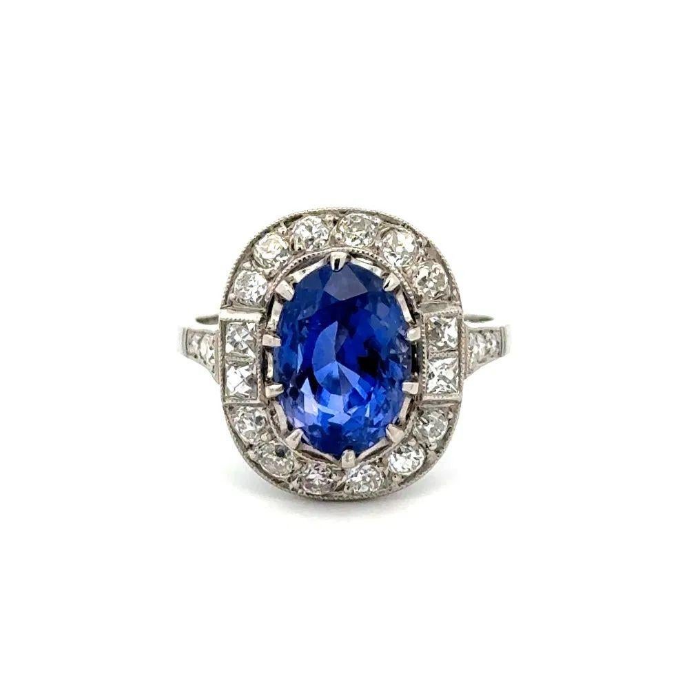 Simply Beautiful! Elegant and finely detailed Vintage NO HEAT Sapphire and Diamond Platinum Ring. Centering a securely nestled Hand set, 4.69 Carat French Cut NO HEAT Sapphire GRS. With pure Mastery, the Sapphire has been cut into an Alluring Oval
