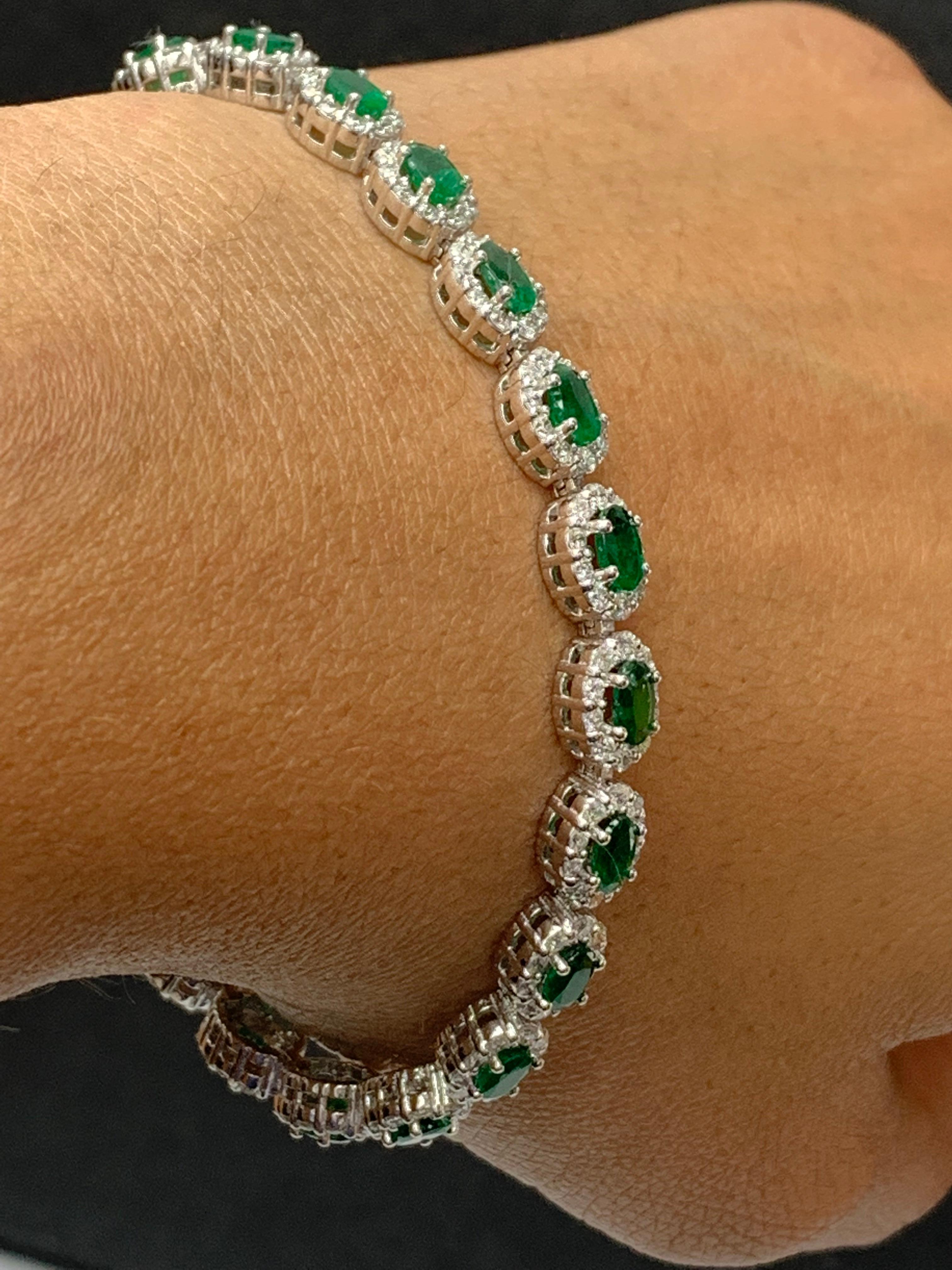 Modern 4.69 Carat Oval Cut Emerald and Diamond Halo Bracelet in 14K White Gold For Sale