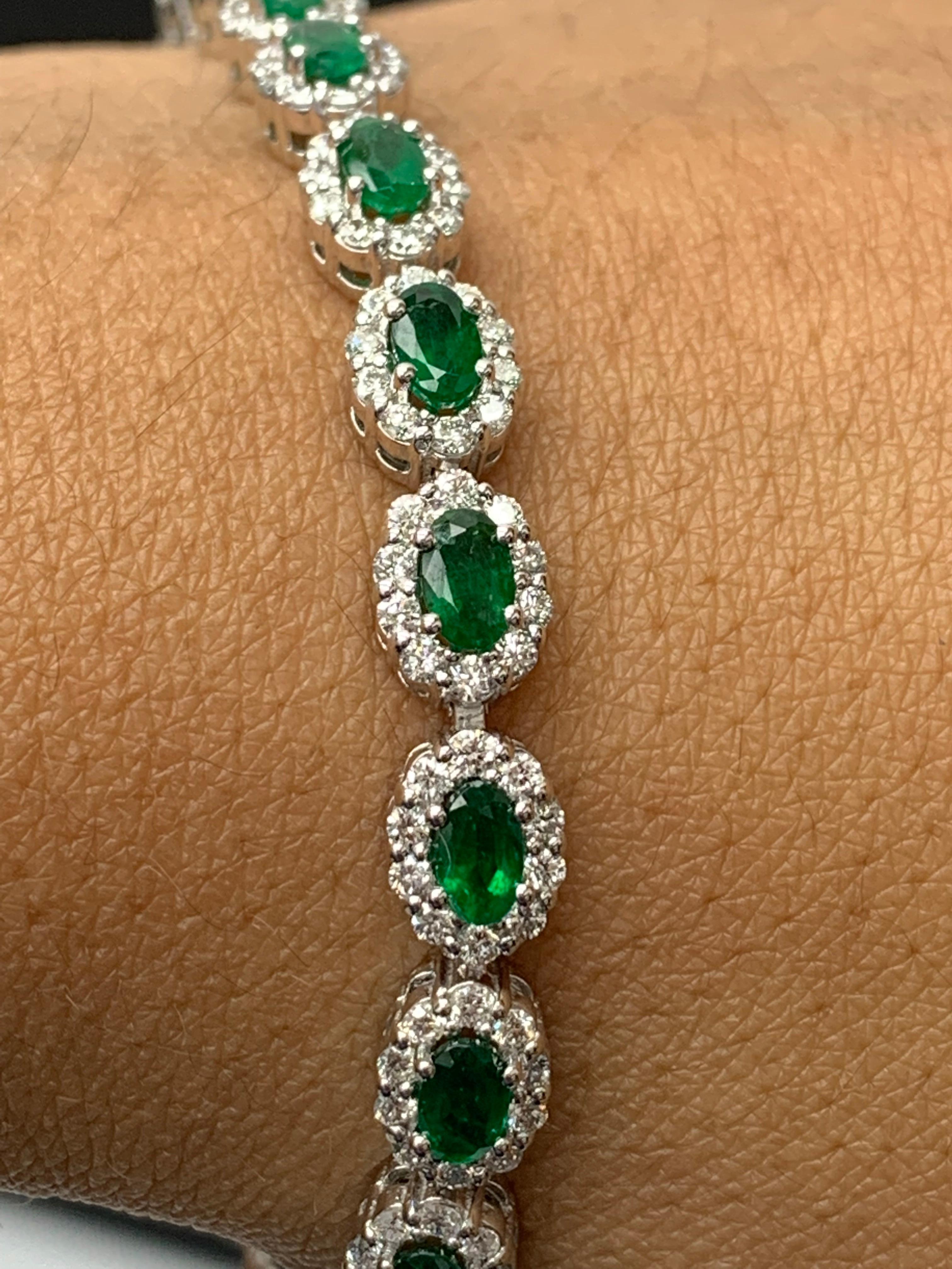 Women's 4.69 Carat Oval Cut Emerald and Diamond Halo Bracelet in 14K White Gold For Sale