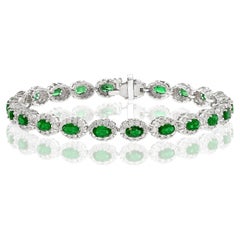 Bracelet en or blanc 14 carats avec émeraude ovale de 4,69 carats et diamant en halo