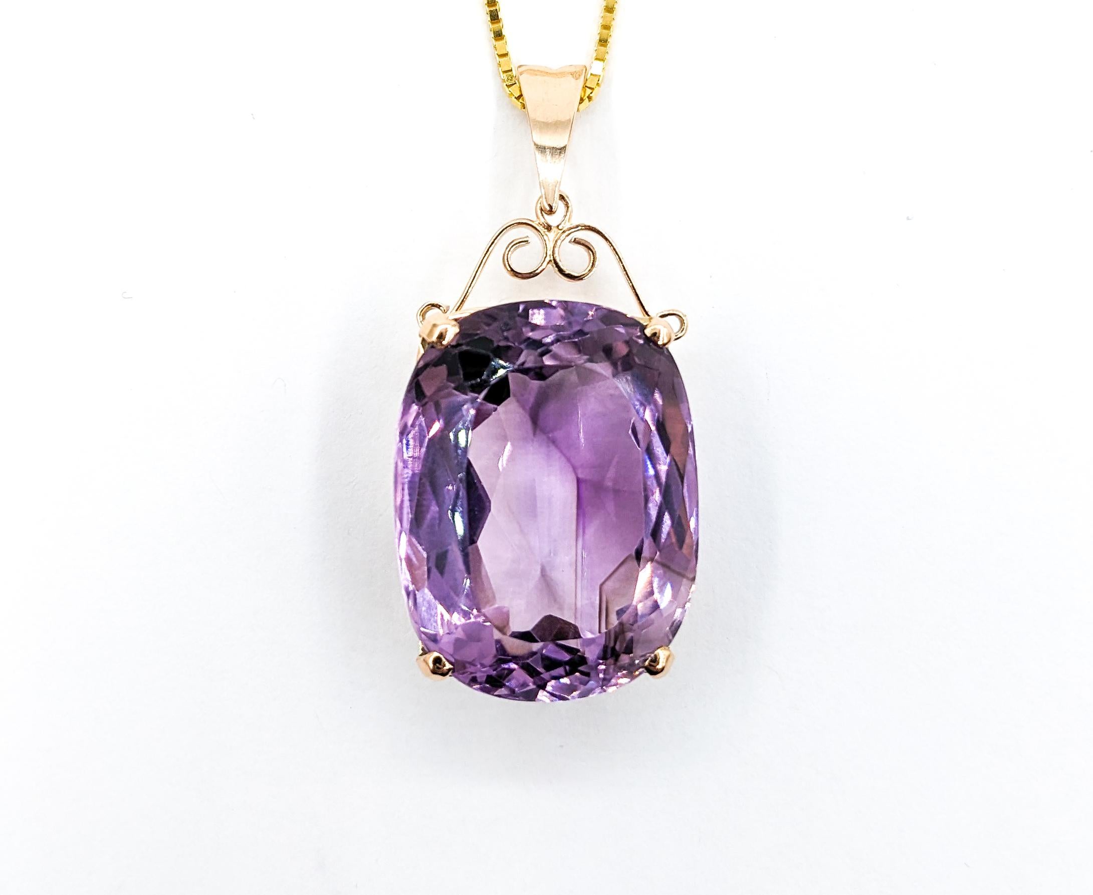 46ct Amethyst pendant With Chain In Yellow Gold

Showcasing a magnificent Gemstone Fashion Pendant, expertly crafted in 10/14kt Yellow Gold. This pendant is adorned with a scroll design, featuring a breathtaking 46ct Amethyst. Paired with a box