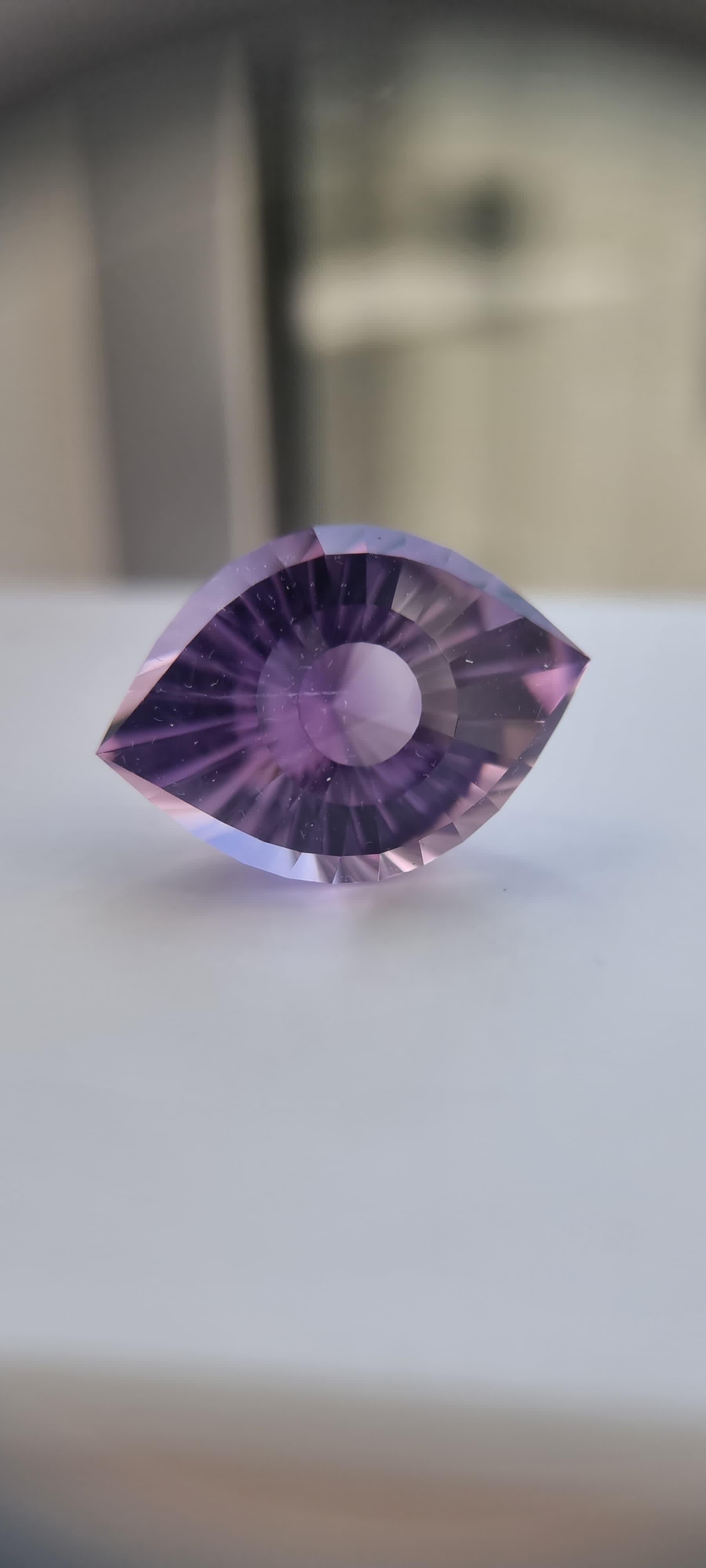 46-Carat Natural Amethyst – Expertly Cut Cleopatra Eye

This 46-carat natural amethyst, measuring 28.33mm x 19.7mm x 17.9mm, is a testament to expert lapidary craftsmanship. Shaped into the Cleopatra Eye, this cut demands precision and technical