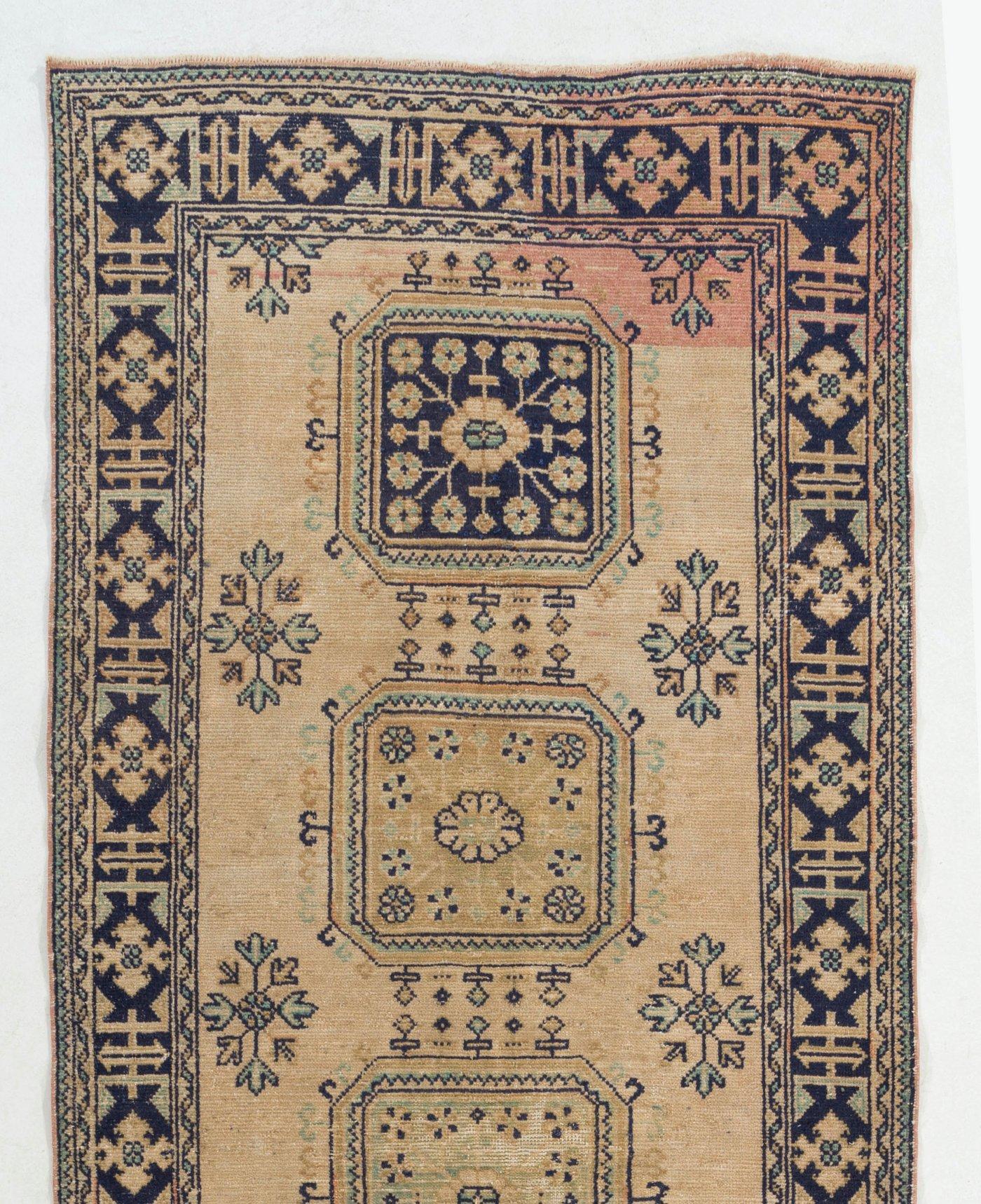 A gorgeous vintage Turkish runner rug for hallway decor. It was hand-knotted in the 1960s with low wool on cotton foundation and features a multiple medallion design. It is in very good condition, professionally-washed, sturdy and suitable for areas
