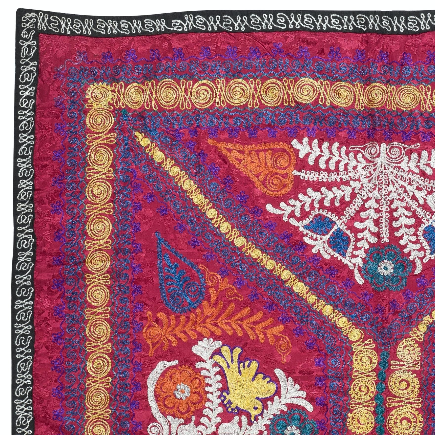Introducing our exquisite new suzani hand embroidered wall hanging, a captivating piece that combines ancient craftsmanship with modern artistry. This embroidered cloth is not just a suzani throw, but a remarkable suzani wall hanging that will