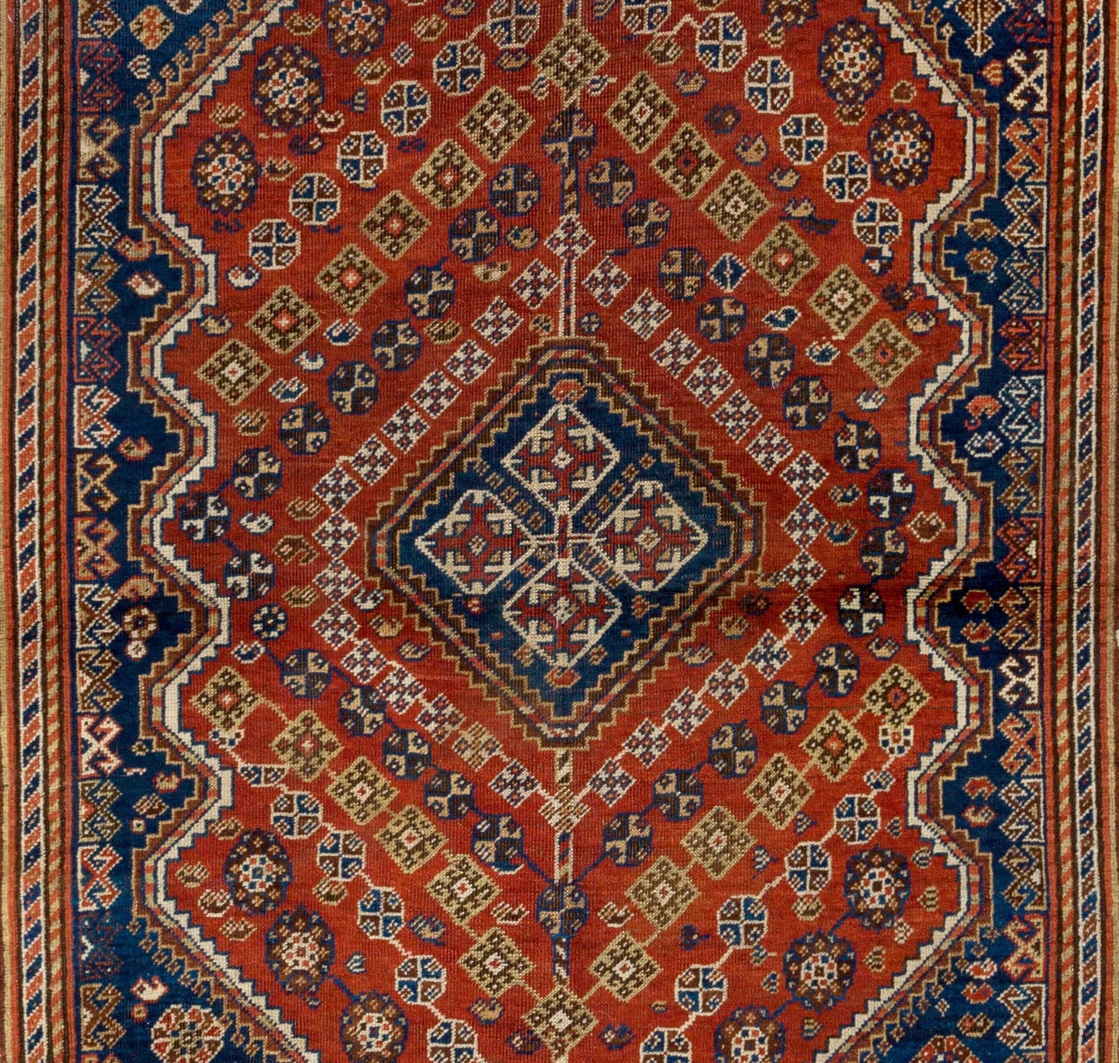 Antique Persian Shiraz Qashqai rug, hand-knotted by the pastoral nomadic Qashqai people in the 19th century made with wool on wool foundation and natural vegetable dyes. The rug has an energetic, lively design, woven with precision and is packed