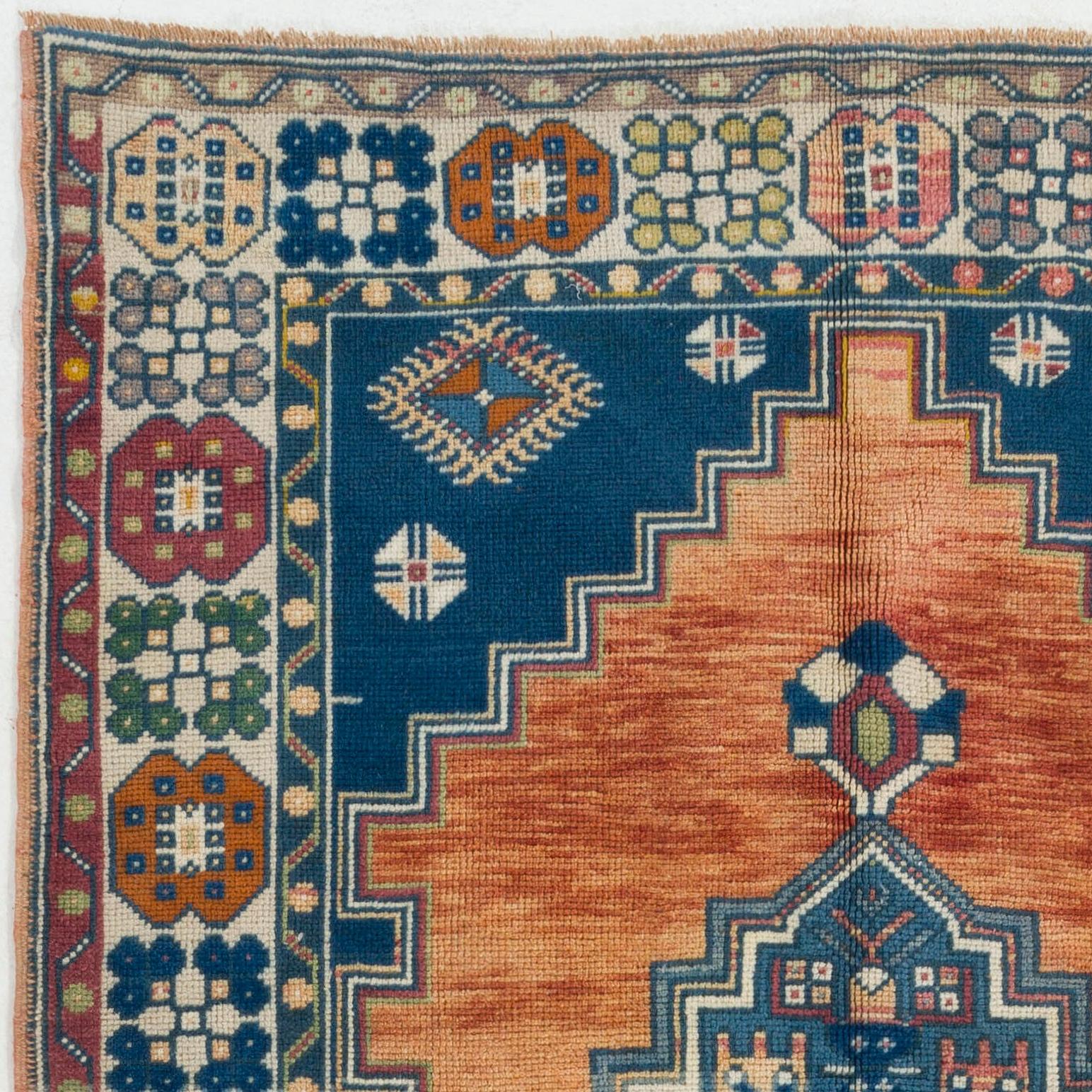 A vintage Central Anatolian area rug with a geometric design and unusual border pattern. Medium wool pile on wool foundation. Washed professionally. Ideal for both residential and commercial interiors. 
Size: 4.6 x 8.8.
    