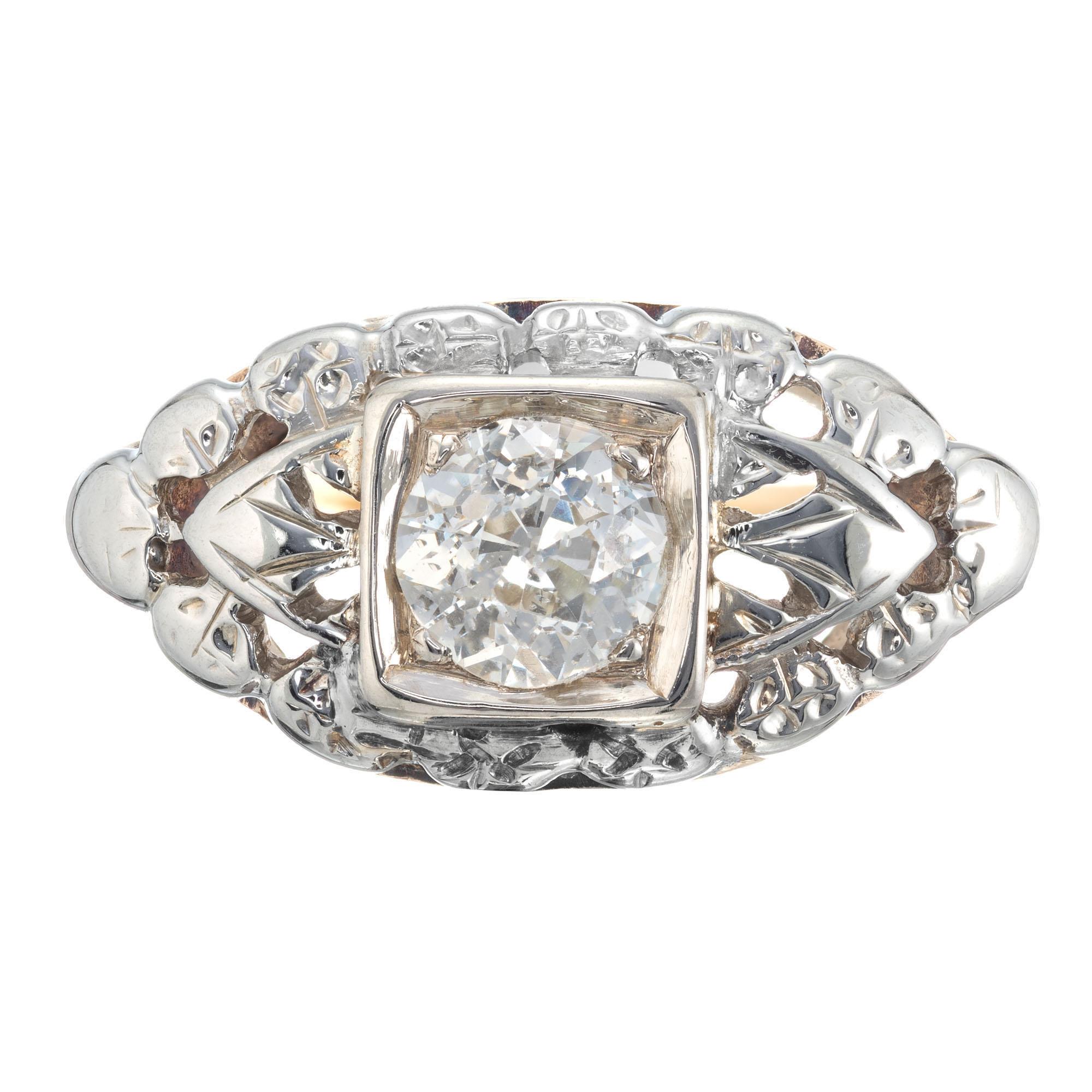 Art Deco diamond engagement ring. .47ct old European center stone in a 18k white gold top with yellow gold band setting. EGL certified. Circa 1920-1929.

1 old European cut .47ct H to I color and SI3 clarity. 4.80x4.78x3.17mm EGL cert#