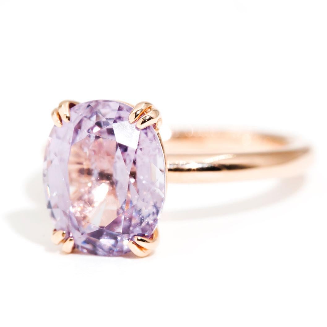 Crafted in 18 carat rose gold is this charming vintage inspired solitaire ring featuring a wondrous 4.70 carat bright light purple oval Spinel. We have named this darling jewel The Leona Ring. The Leona Ring is a sweet ring that is embodies romance
