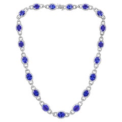 Collier succession en or blanc 18 carats, tanzanite ovale de 47 carats et diamants de 8 carats