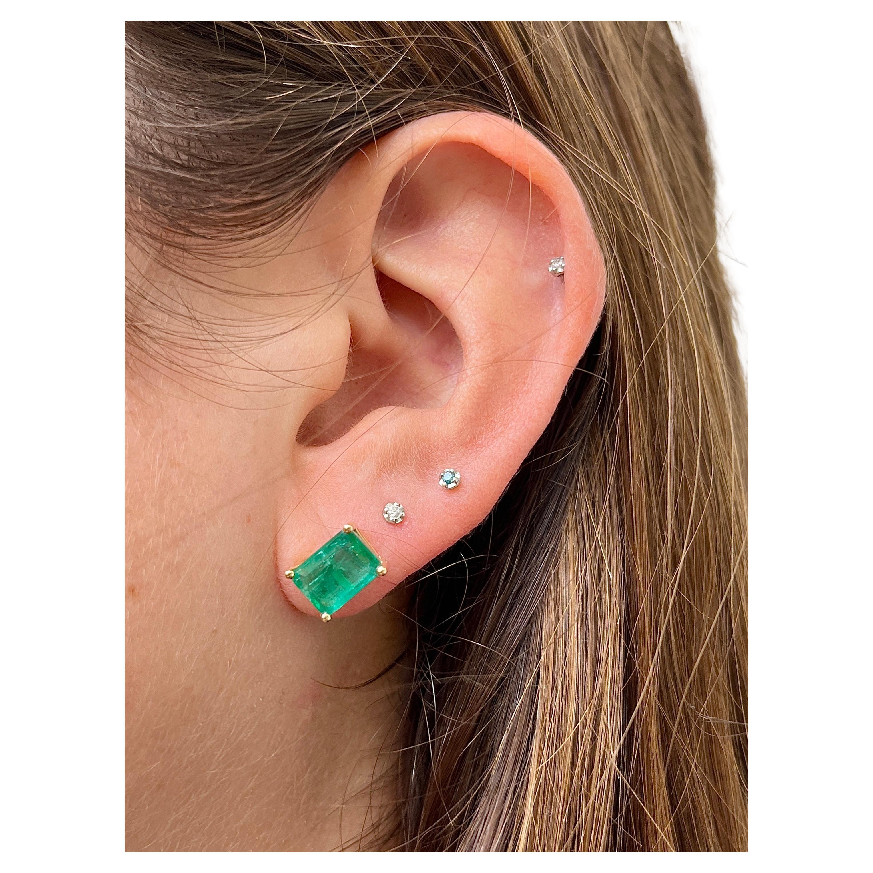 Our stunning 4.77 carat total weight natural emerald cut emerald stud earrings are a testament to the opulence of fine jewelry. With vibrant green gemstones and expert craftsmanship, these earrings offer a luxurious and sophisticated addition to any