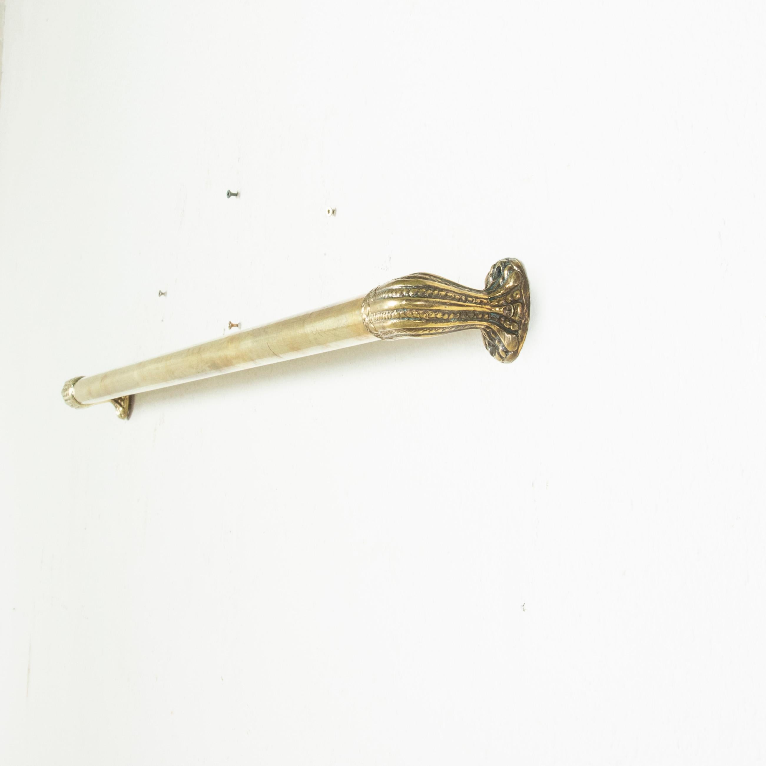 Originally used as a hand rail with its 47 inch length, this French Art Nouveau period brass bar from the turn of the 20th century features Inverted fluting alternated with beading at each end. An elegant piece, ideal for use as a towel bar or