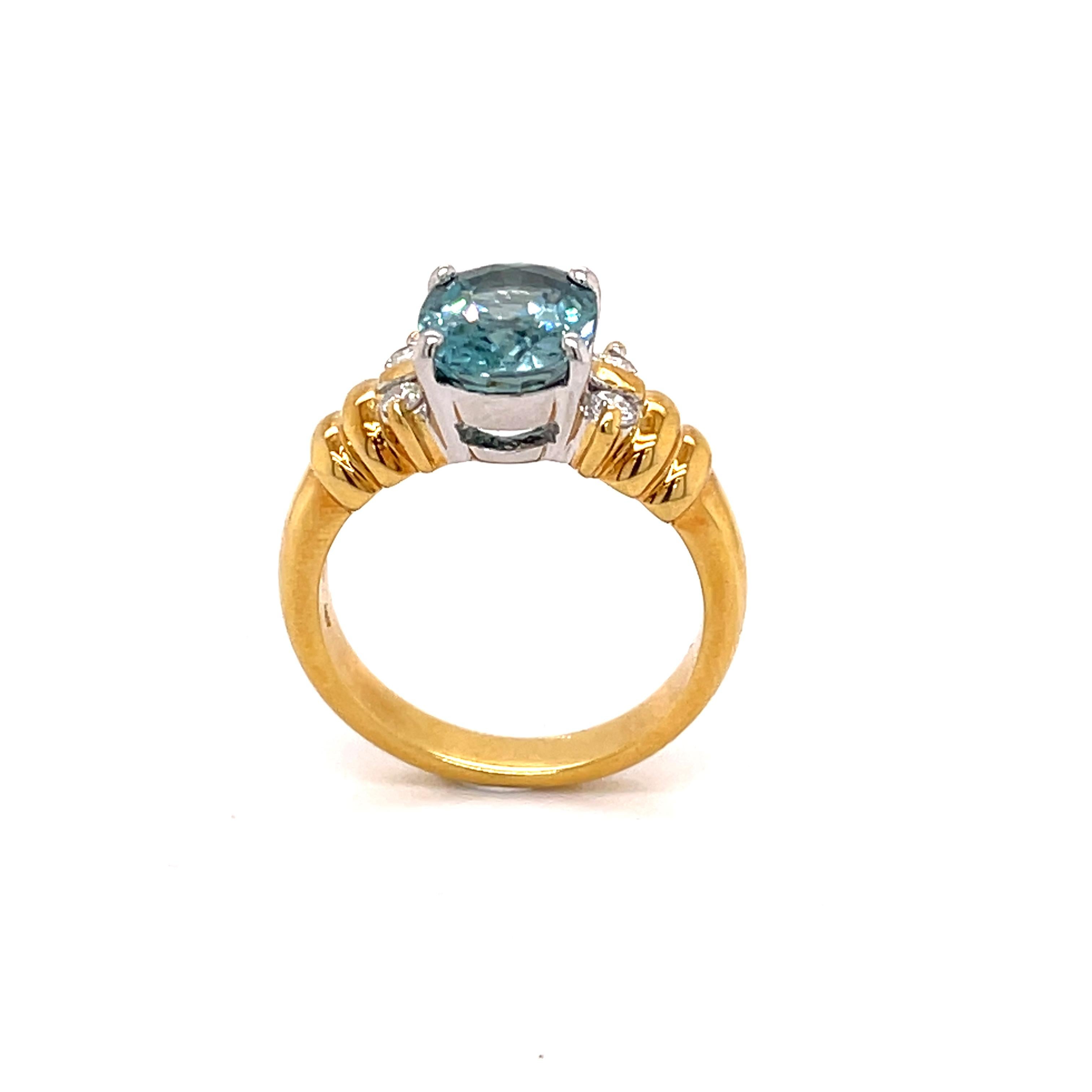 Oval Cut 4.70 Carat Blue Zircon and Diamond Gold Ring