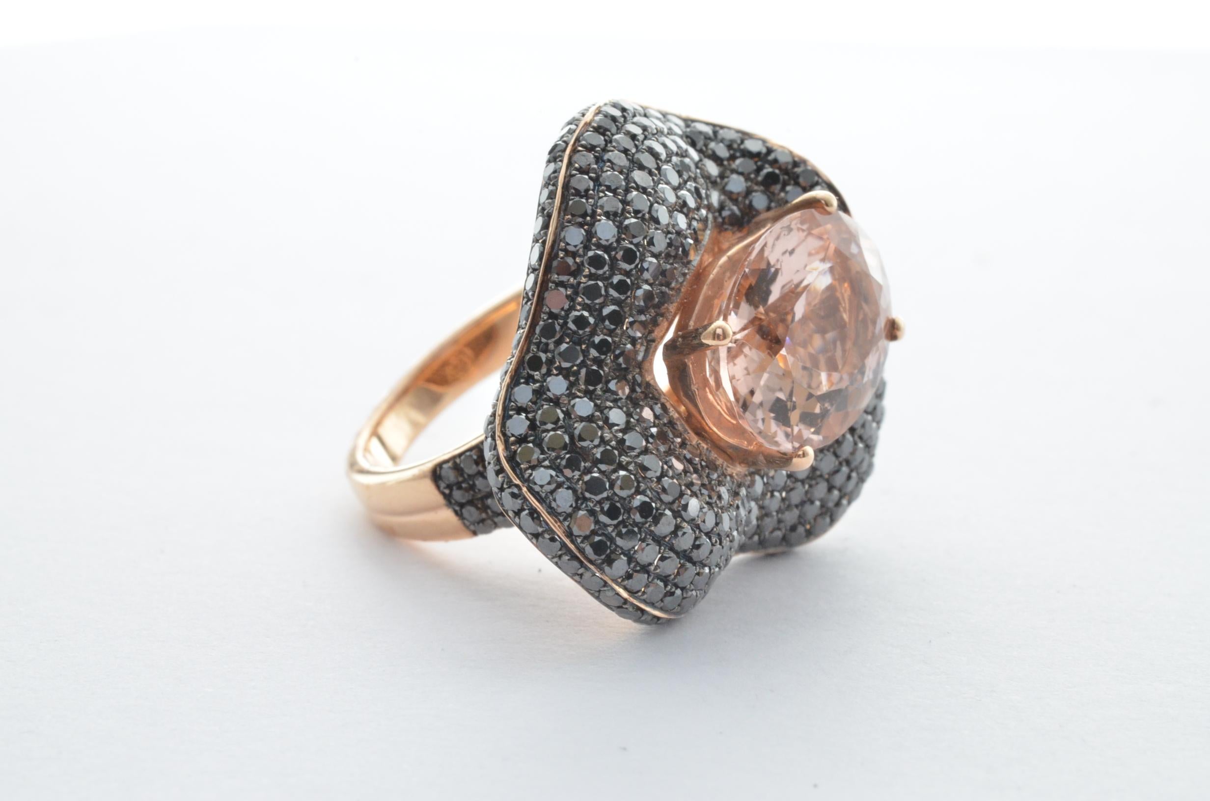 This collection features an array of magnificent morganites! Accented with Black Diamonds these rings are made in Rose gold and present a classic yet elegant look. 

Classic morganite ring in 14K Rose gold with Black Diamonds. 

Morganite: 4.70