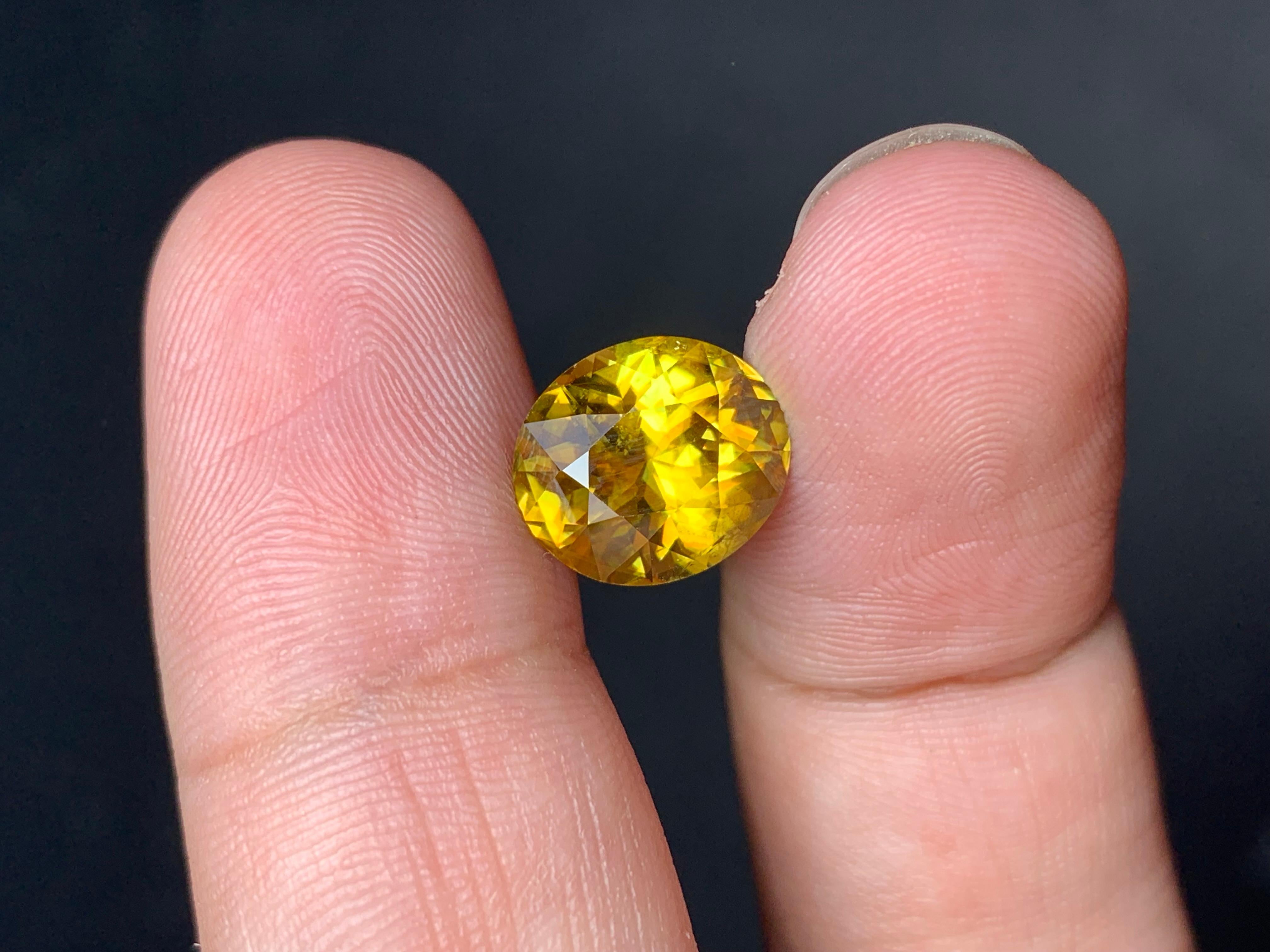 Loose Sphene
Weight: 4.70 Carats
Dimension: 11.3 x 9.8 x 6.5 Mm
Origin: Warsak Pakistan
Shape: Oval
Color: Yellow Fire 
Treatment: Non
Certificate: On Demand

Sphene, also known as titanite, is a remarkable and lesser-known gemstone that has