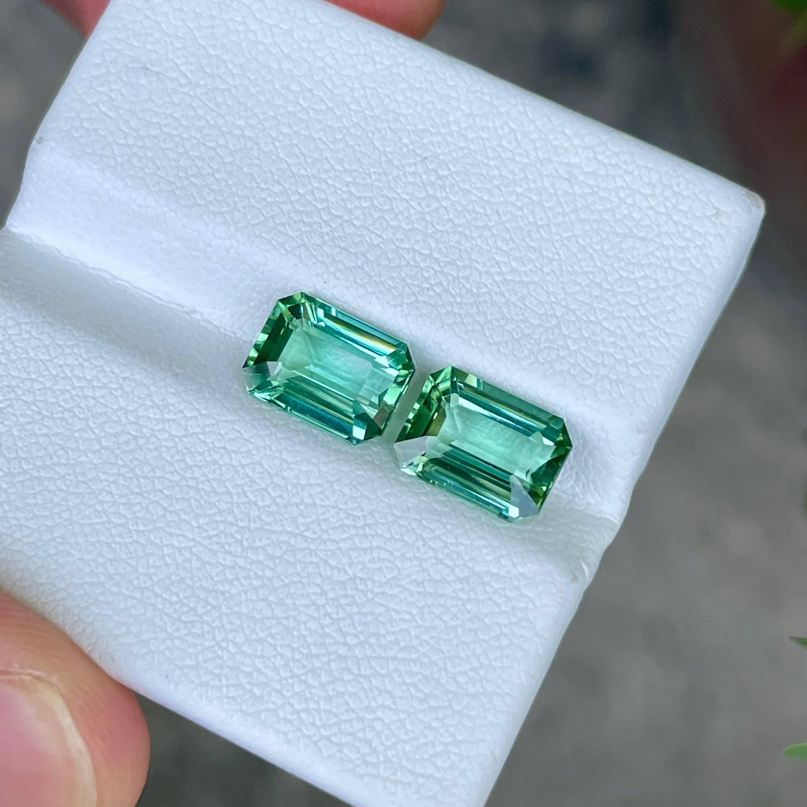 Weight 4.70 carats
Dimensions 9.2x6.85x4.6 mm
Treatment none 
Origin Afghanistan 
Clarity VVS (Very, Very Slightly Included)
Shape octagon 
Cut emerald 





Behold the exquisite allure of this stunning pair of Sea Blue Tourmaline gemstones, each