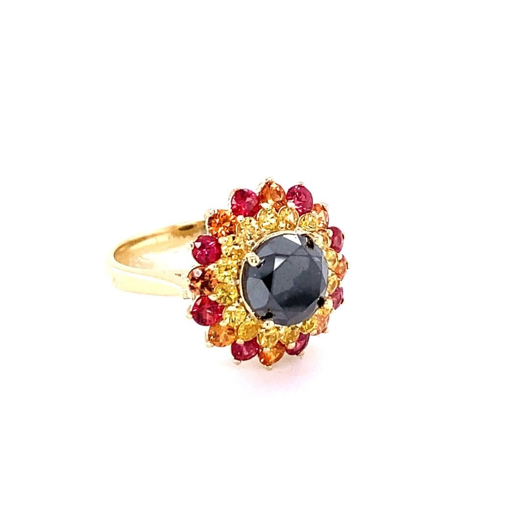 Gorgeous Black Diamond ring that can transform into an Engagement ring or a gorgeous Cocktail ring.  

There is a 2.67 Carat Round Cut Black Diamond in the center on the ring.  The Black Diamonds is surrounded by 16 Yellow Sapphires that weigh 0.64