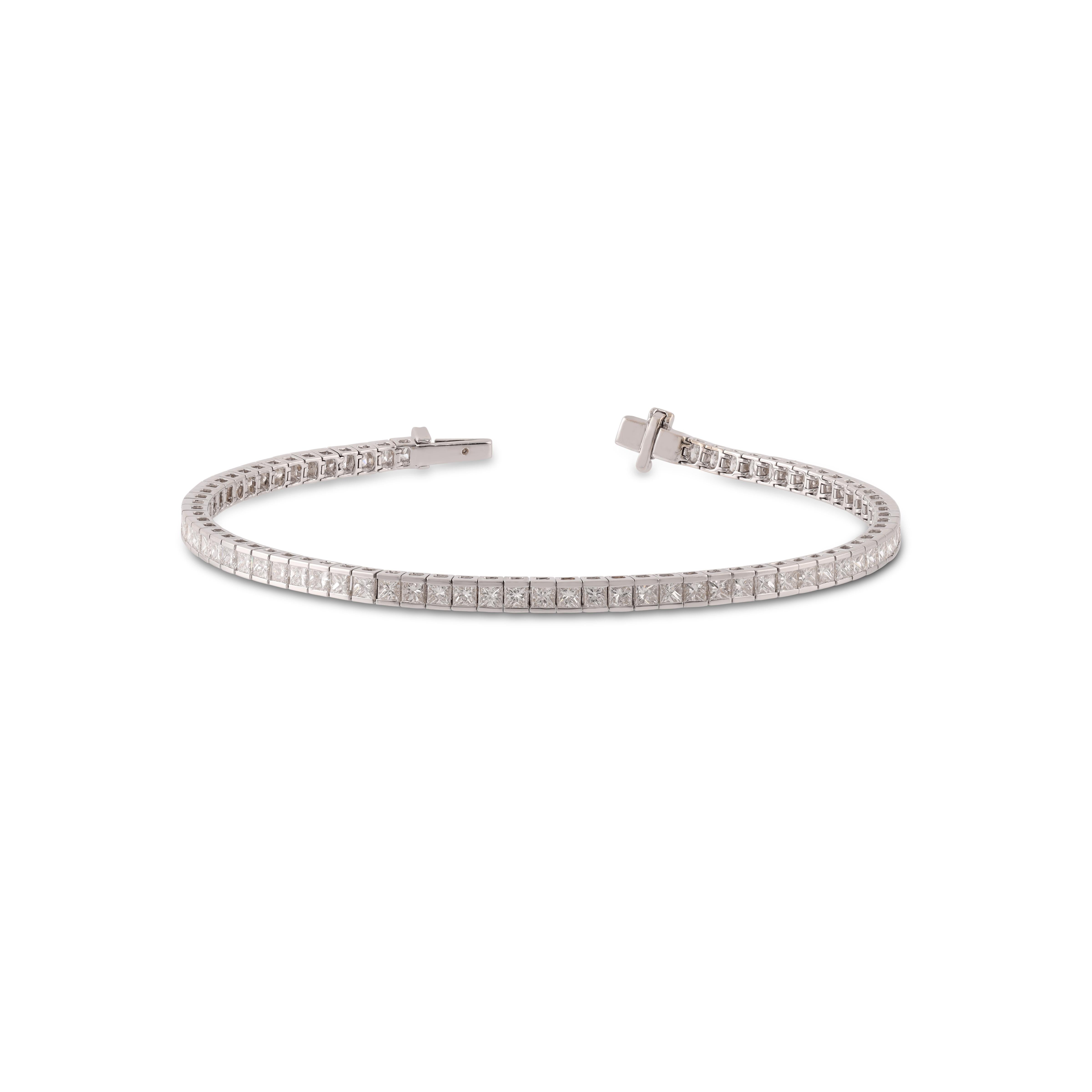 This is an elegant Diamond   bracelet features 75 pieces of princess cut Diamond  4.72 carat in the channel setting, this bracelet entirely made in 18 karat White gold, this is a classic tennis bracelet.