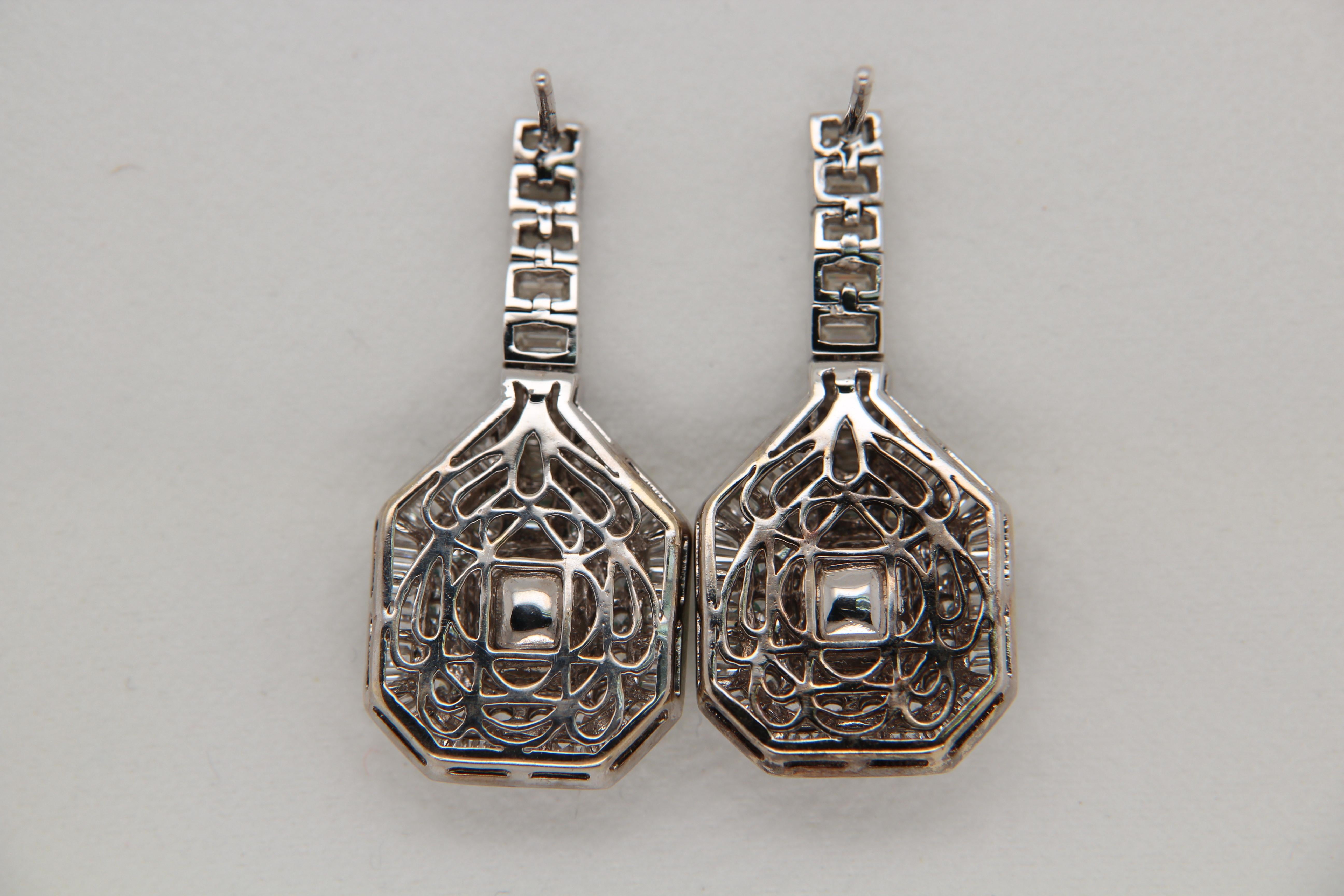 A brand new emerald and diamond earring made in 18 karat gold. The total emerald weight is 4.72 carats and the total diamond weight is 3.32 carats. The whole earring weighs about 14.47 grams.