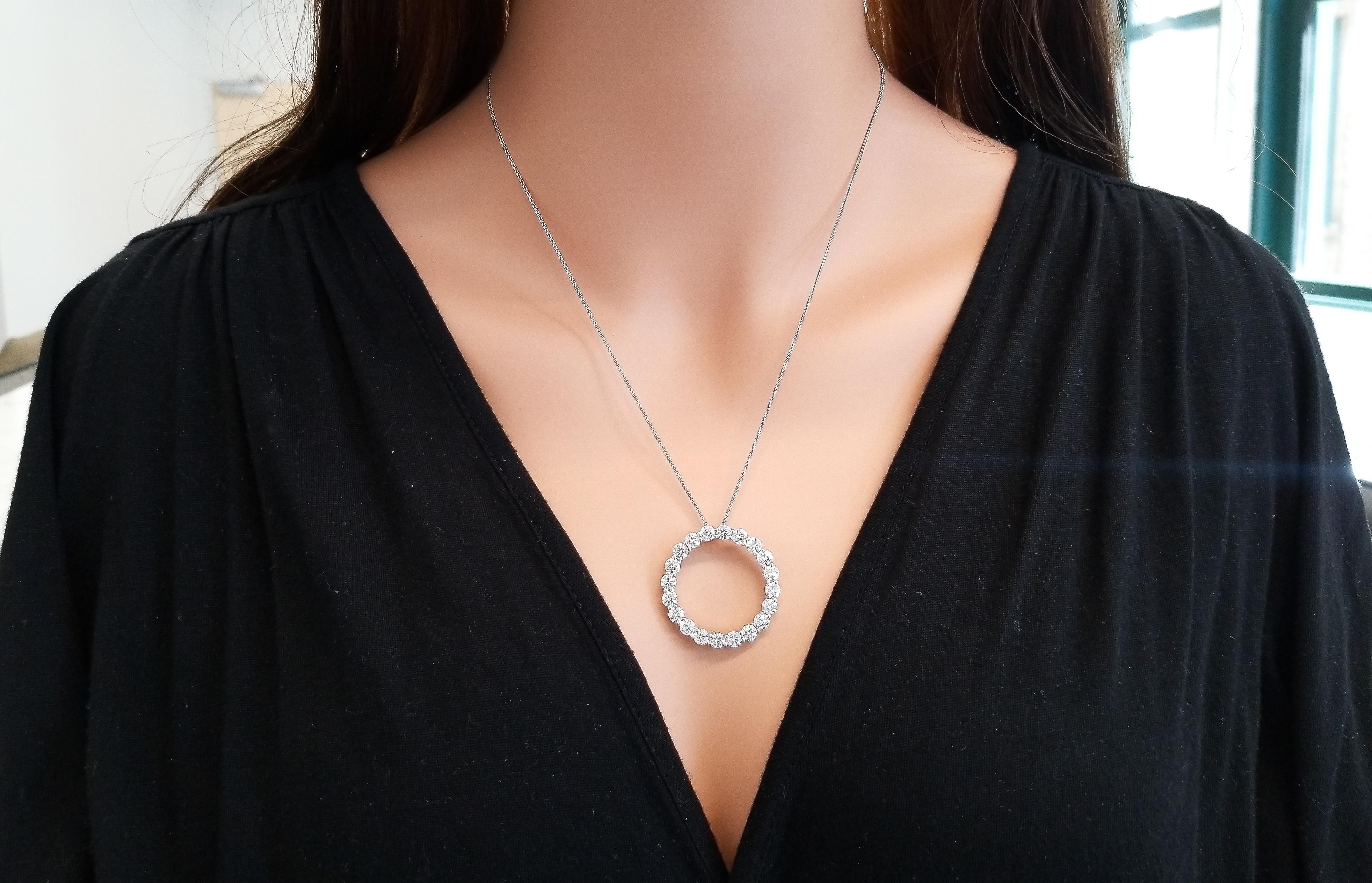 This circle pendant is blazing with fiery round brilliant diamonds. This piece is classic yet bold because of its size. Wear it with your favorite casual attire, or your dressiest dress. Thanks to the high quality 4.72 carat total of glimmering
