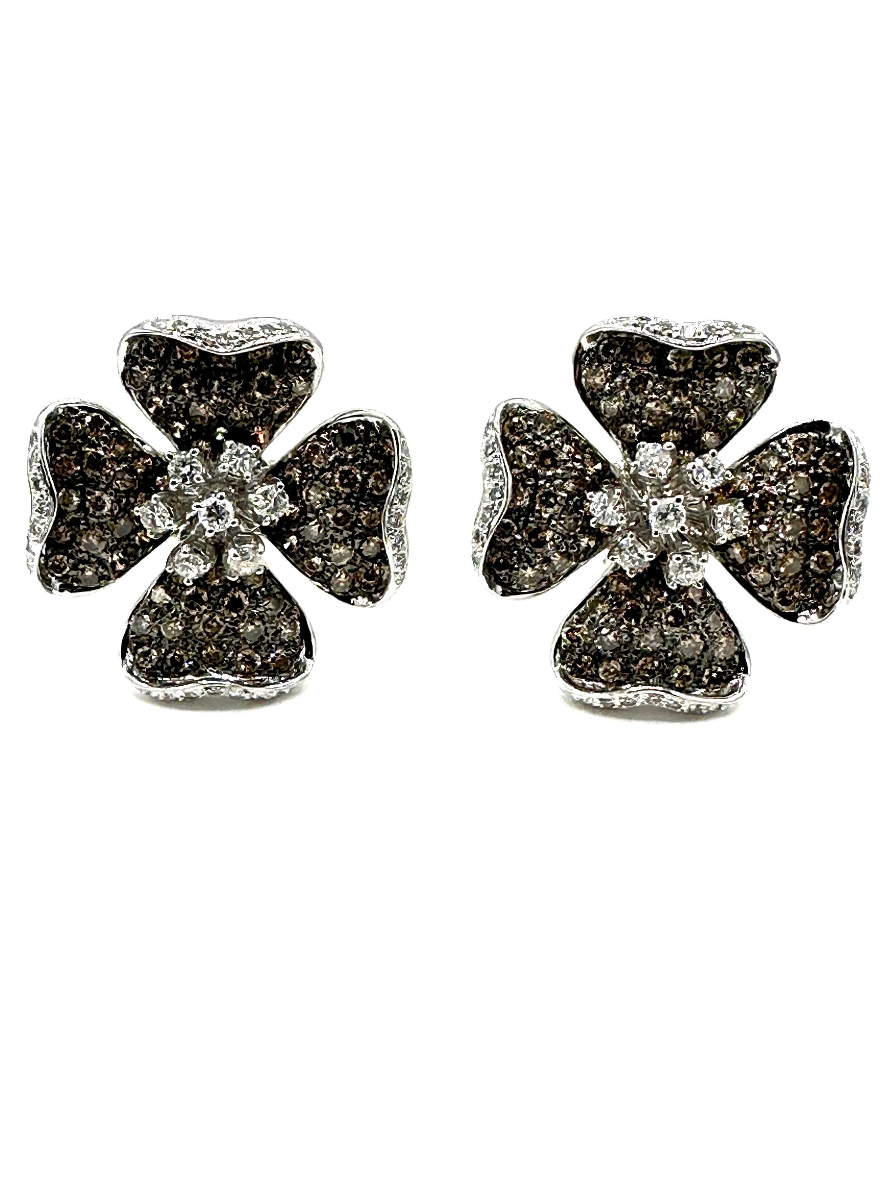 These dogwood earrings are shining bright with 220 round brilliant cognac and white Diamonds!  The Diamonds combine for a total weight of 4.72 carats set in 18K white gold.  The earrings feature a post with an omega clip closure, and the back center