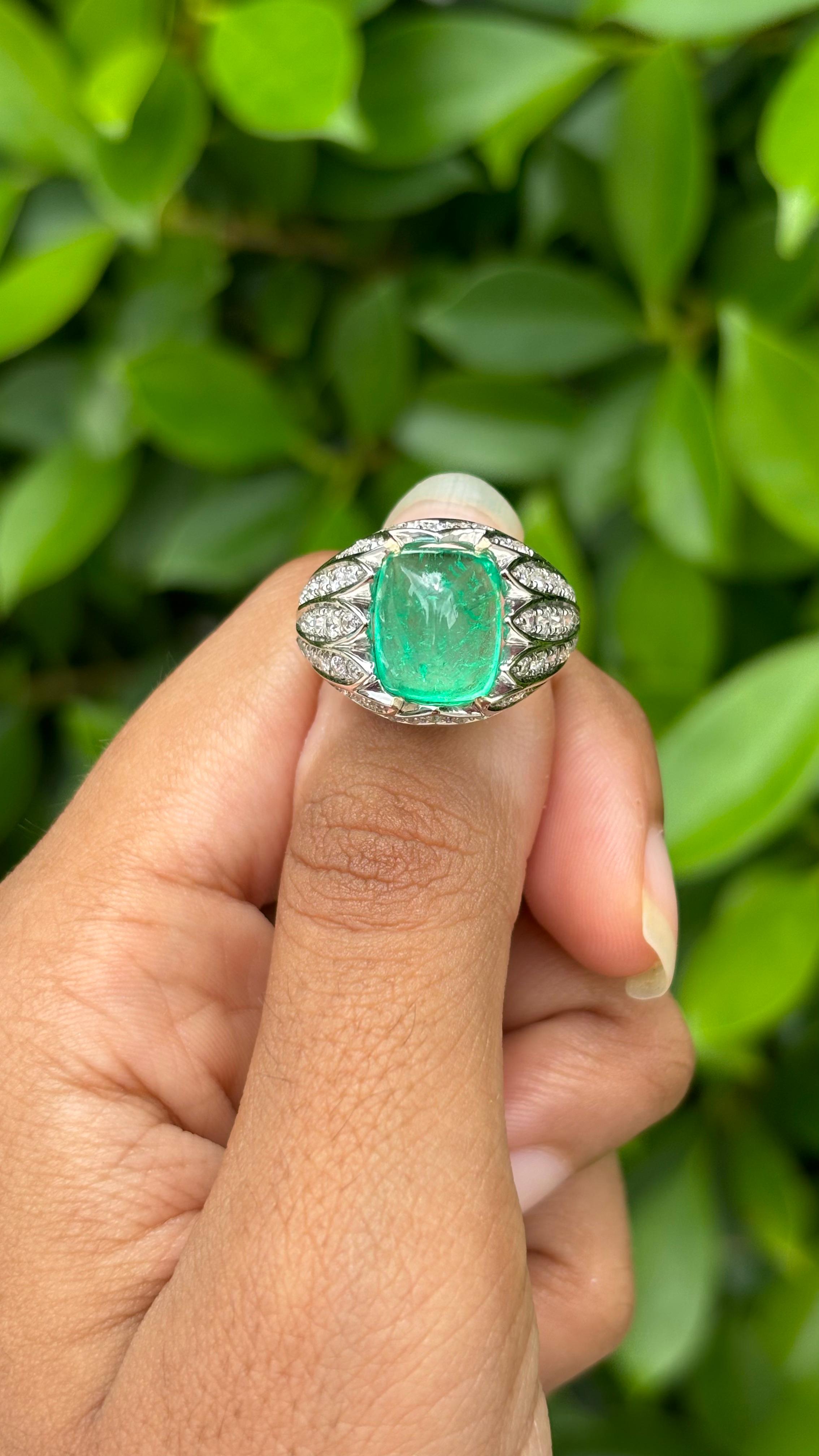 Presenting a masterpiece of a ring that perfectly combines the green elegance of a meticulously cut Emerald with the brilliance of sparkling Diamonds.

Originating from the enchanting mines of Colombia, the 4.72 Carat Emerald boasts a striking green