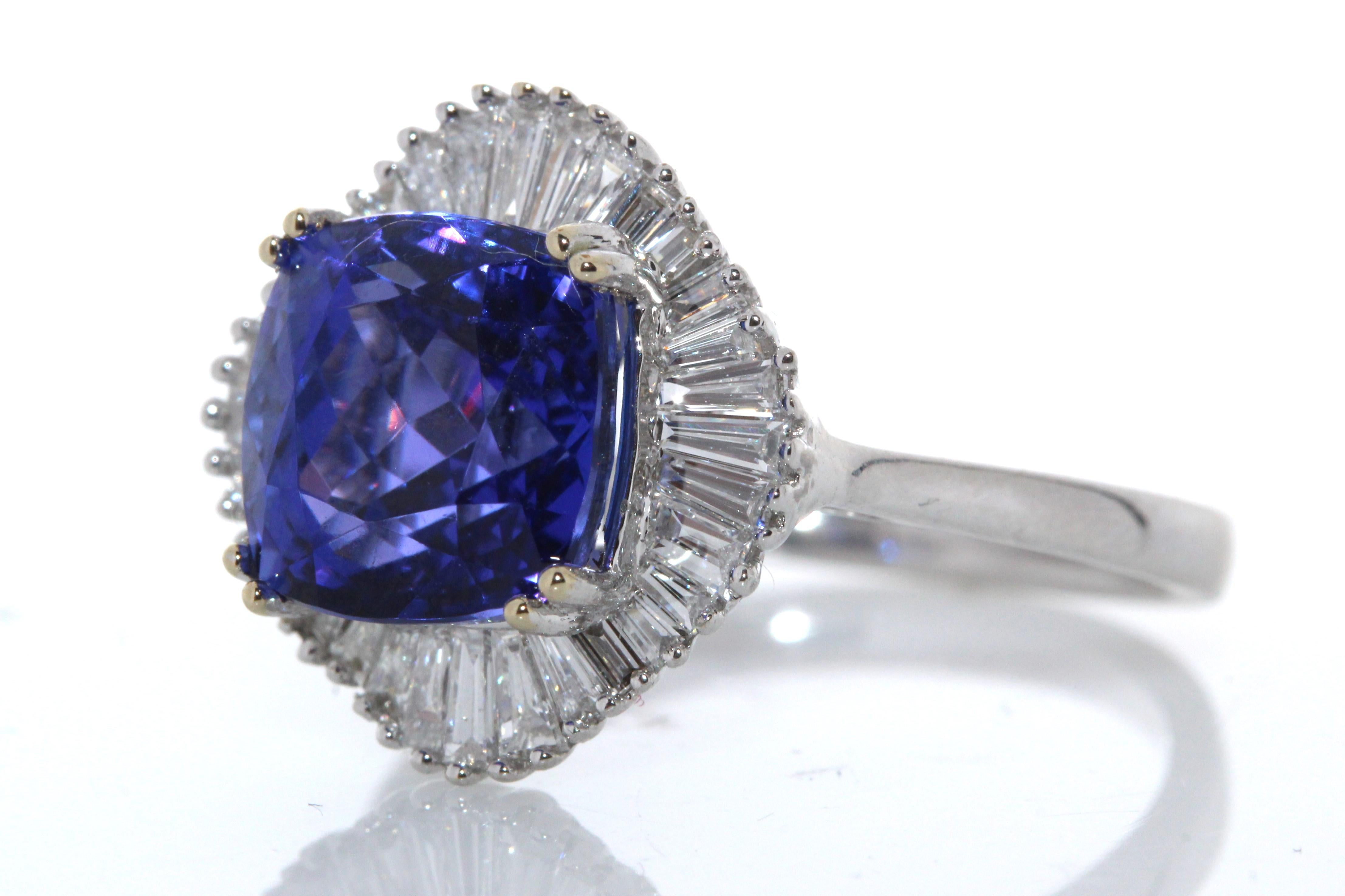 Contemporary 4.72ct Tanzanite and .62ctw Diamond Ring in 18K White Gold For Sale