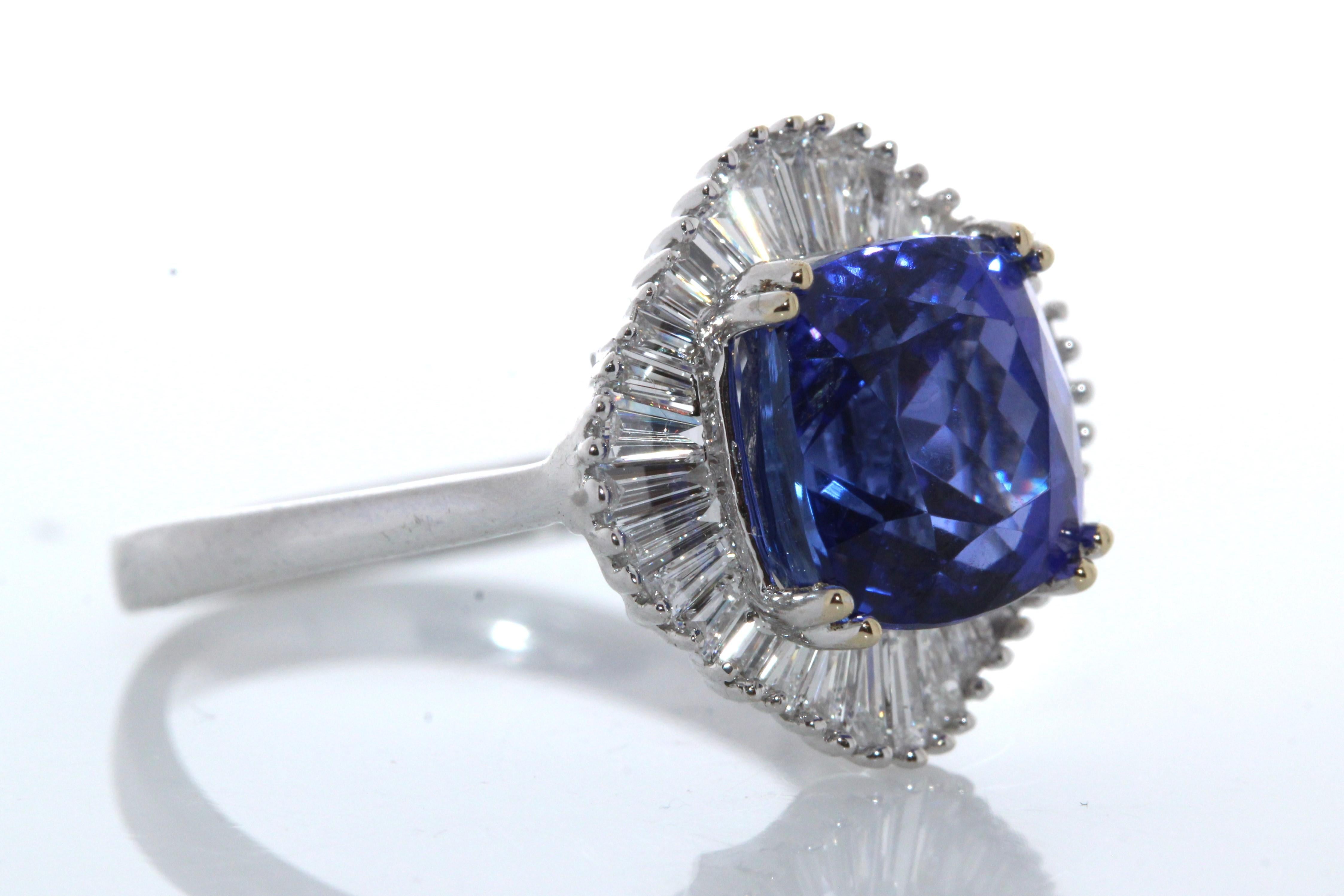 Oval Cut 4.72ct Tanzanite and .62ctw Diamond Ring in 18K White Gold For Sale