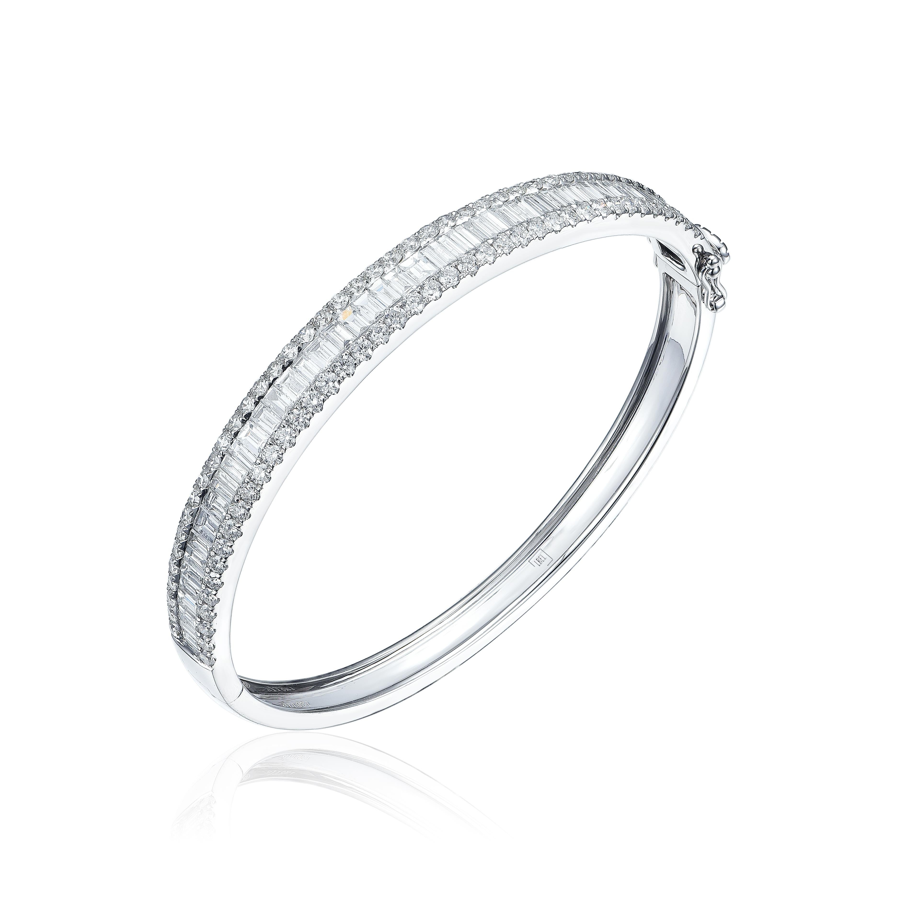 This bangle has 4.73cts of G color, VS2 clarity, baguette and round white diamonds set in 18K white gold. 