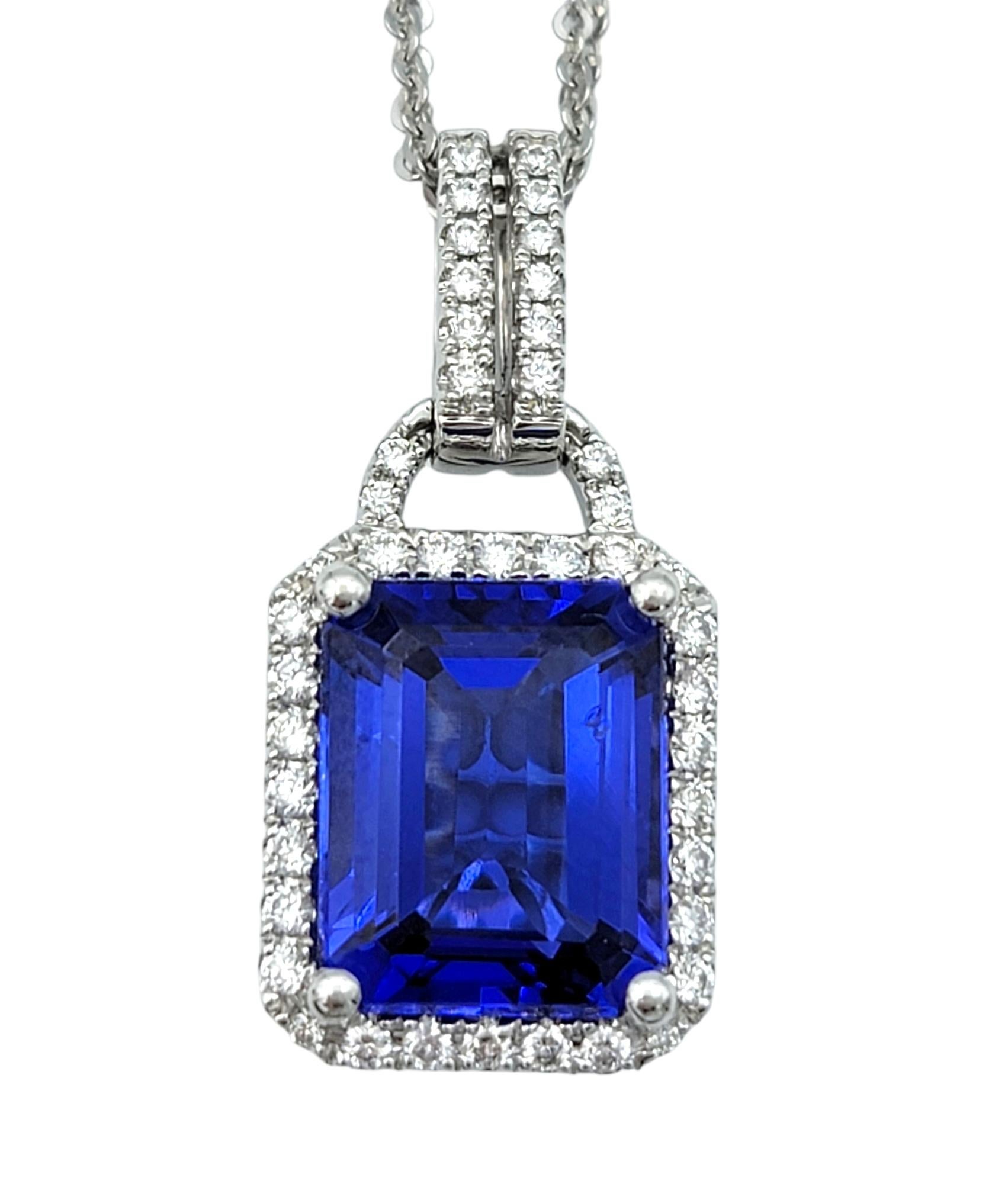 Contemporary 4.73 Carat Emerald Cut Tanzanite & Diamond Halo 18 Karat Gold Pendant Necklace For Sale