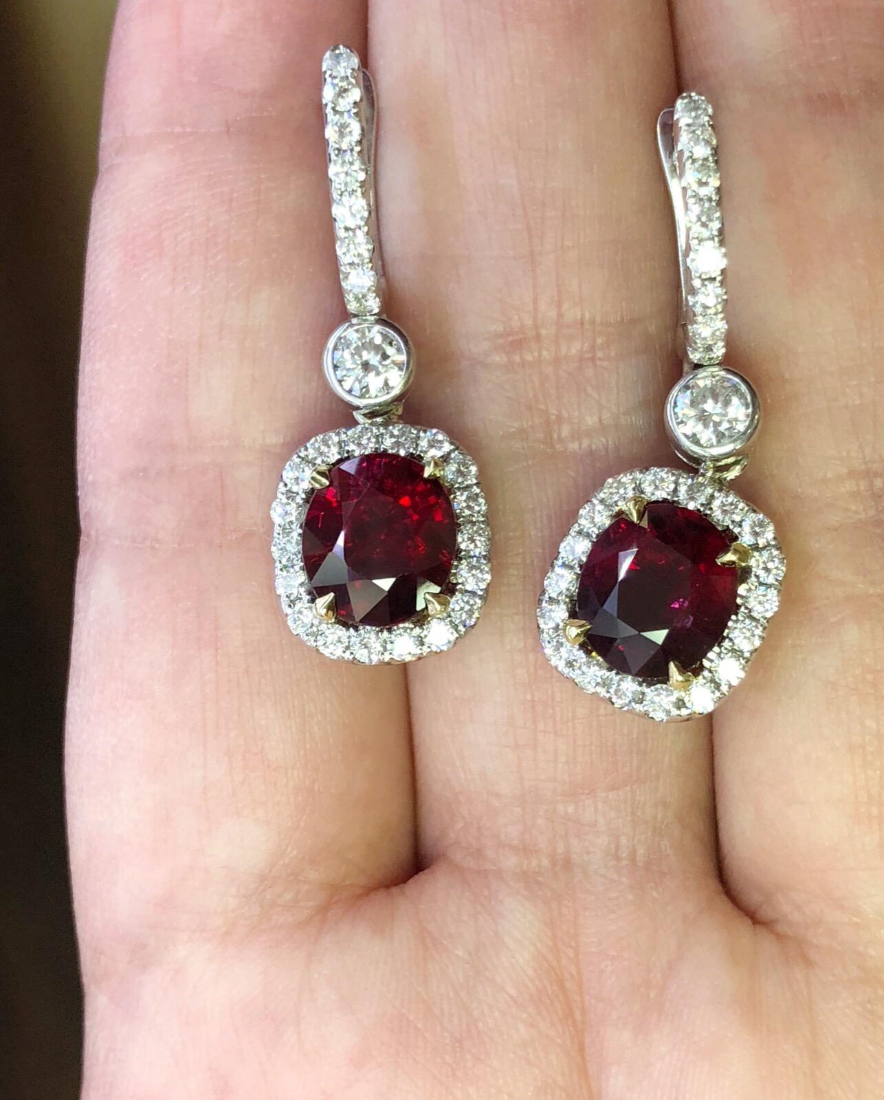 4.74 Carat total weight of natural oval rubies (GIA reports for both rubies) with 1.10 CTW of round brilliant diamonds in 18K white gold earrings. The rubies are a rich, saturated red color and wonderfully mathched.

Measurements of Ruby 1 - 2.59