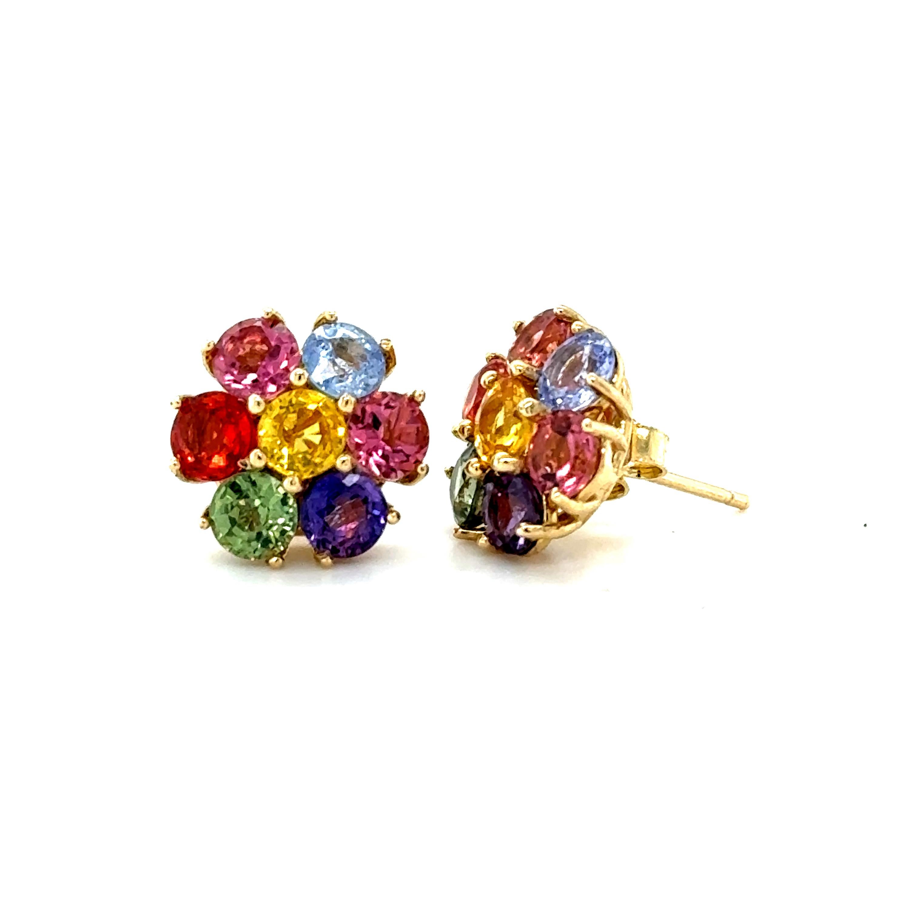 Cute, dainty earrings that are versatile and great for an everyday look! 
4.74 Carat Natural Multi Color Sapphire Yellow Gold Stud Earrings

There are 14 Multi-Colored Sapphires (3.68 carats) and Pink Tourmalines (1.06 carats) set to create a Flower