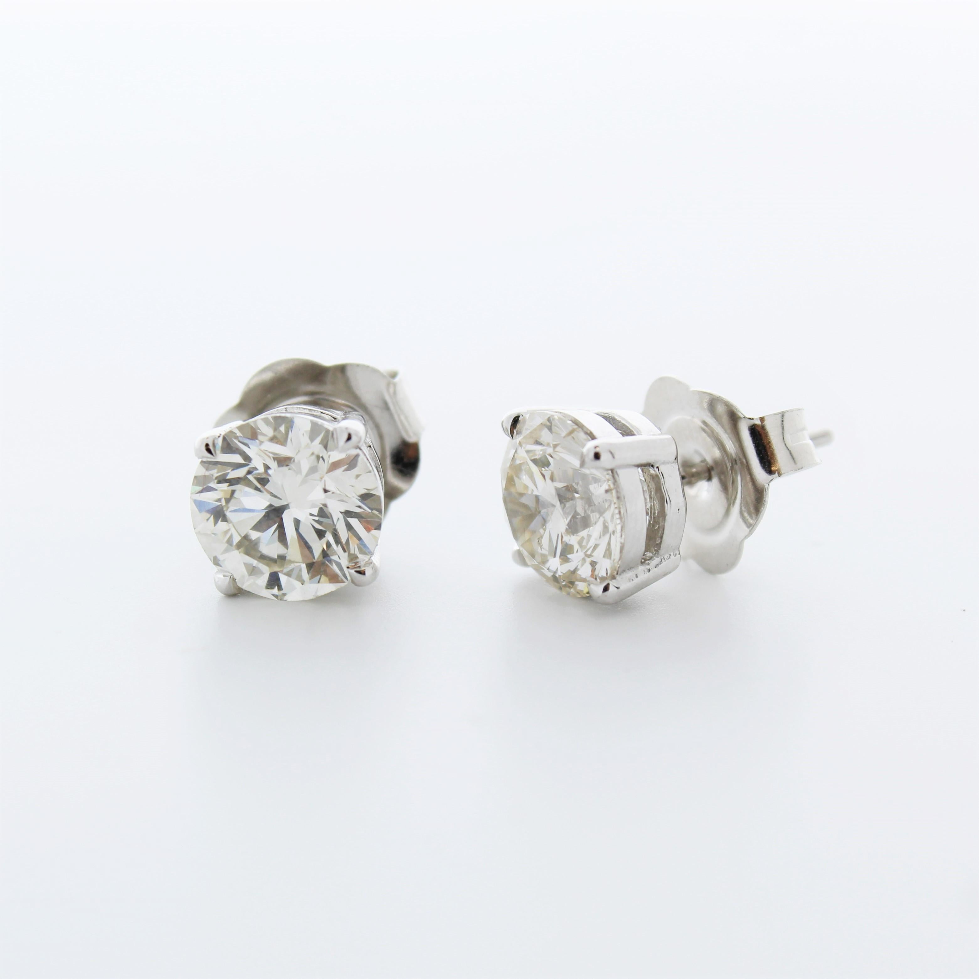 Contemporary 4.74 Total Carat Weight EGL Certified Round Diamond Studs In 14k White Gold For Sale