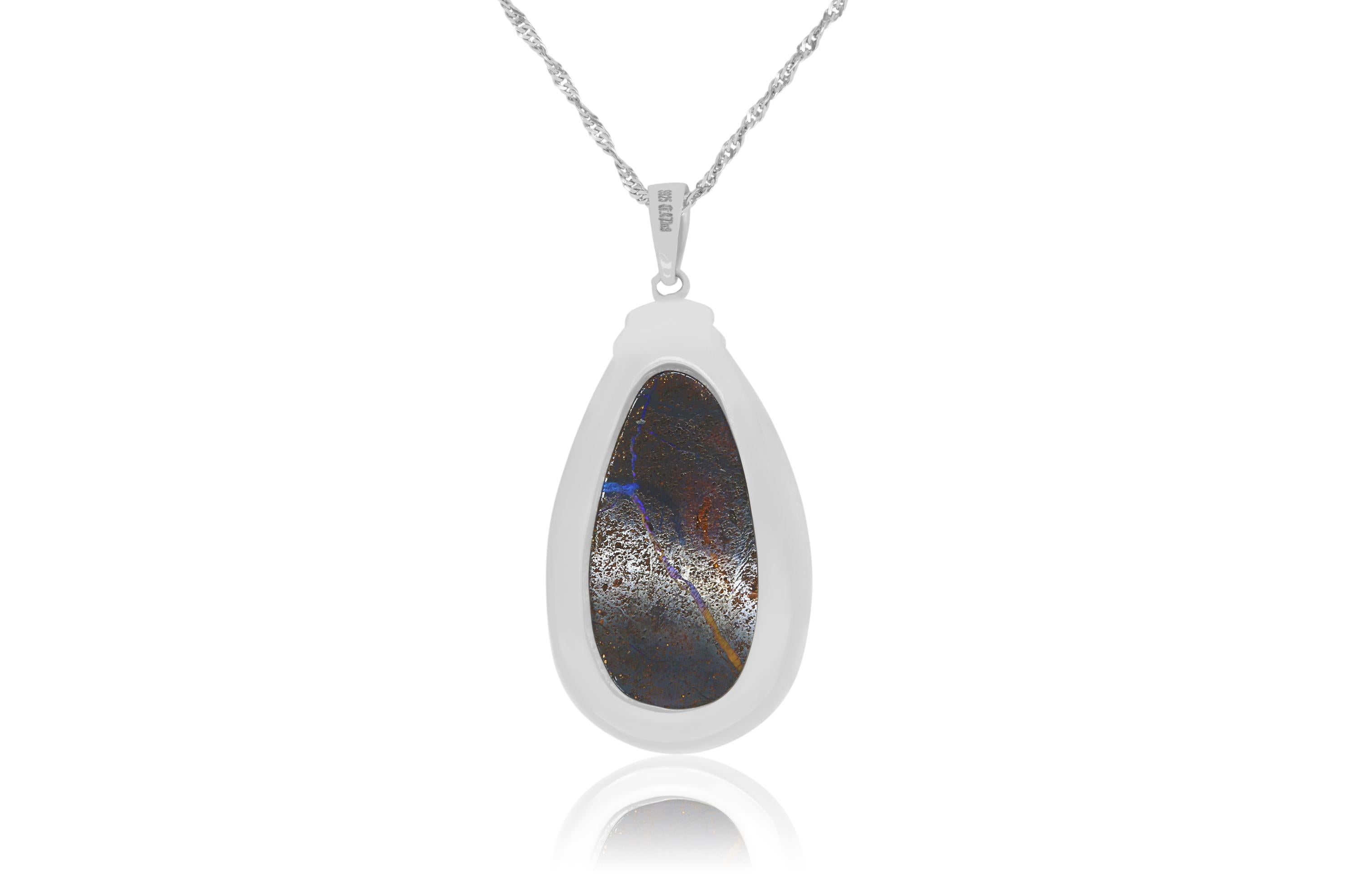 A unique piece, this Opal weighs in at 47.47 carats and is a true showstopper! 

Material: Silver
Center Stone Details: 1 Opal at 47.47 Carats
Chain:  18 inch

Fine one-of-a kind craftsmanship meets incredible quality in this breathtaking piece of