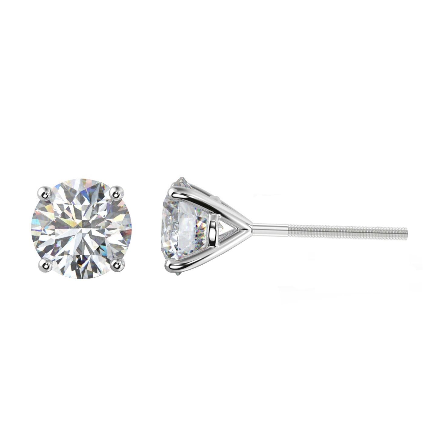 A MUST-HAVE pair of 4.74-carat diamond Stud Earrings. Elegant beautiful 4-prong Martini style setting holds round cut diamonds. All diamonds are natural, These Earrings Feature H Color Grade and Si2 / Si3 Clarity Grade with 8.38mm - 8.40mm on one