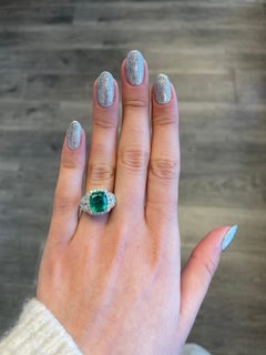 4.74ctt Emerald with Diamond Three Stone Halo Ring 18 Karat Gold
