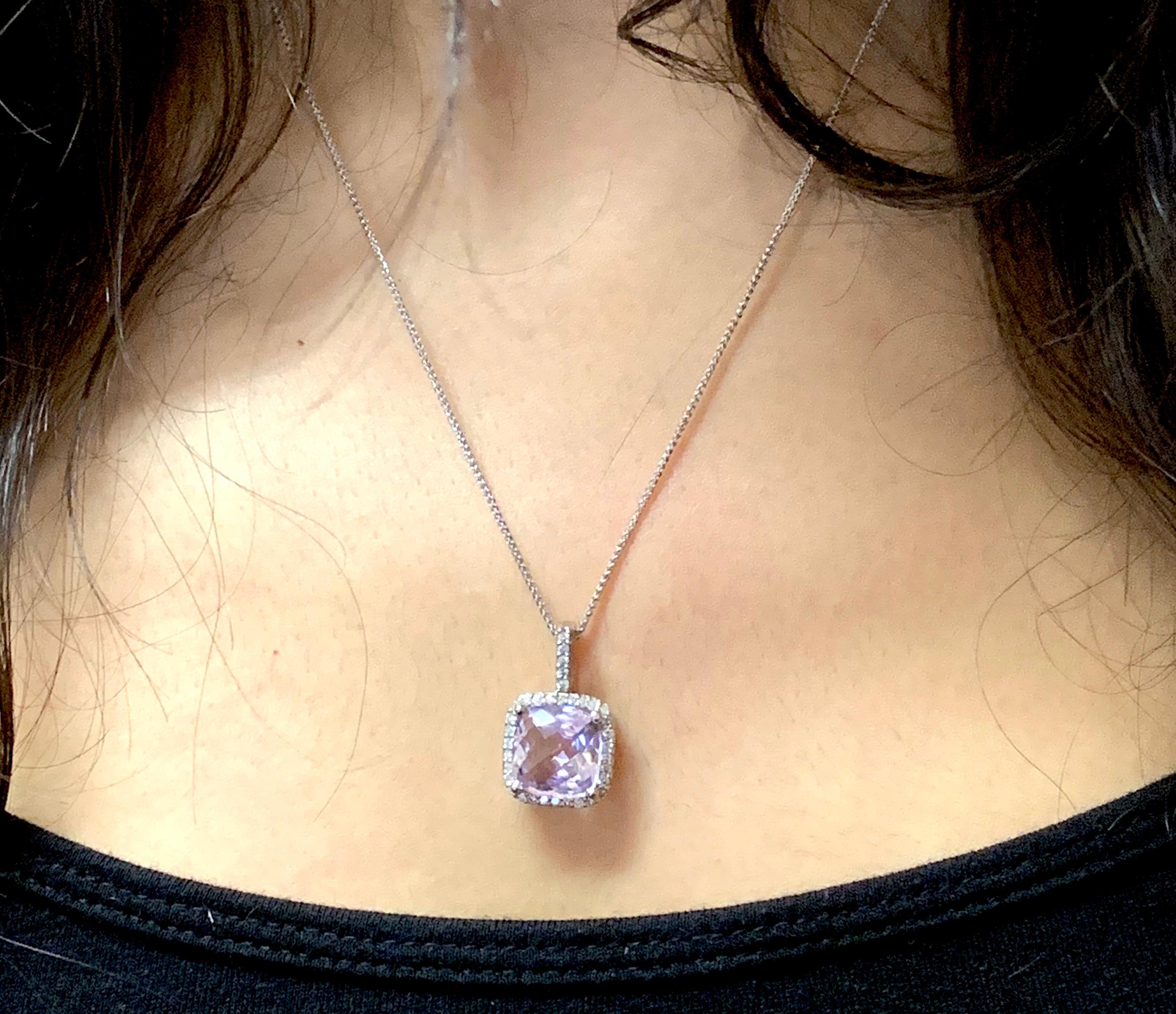 Material: 14k White Gold 
Center Stone Details: 4.75 Carat Cushion Cut Rose Amethyst 11 mm
Mounting Diamond Details: 35 Round White Diamonds Approximately 0.38 Carats - 
Clarity: SI / Color: H-I

Fine one-of-a-kind craftsmanship meets incredible