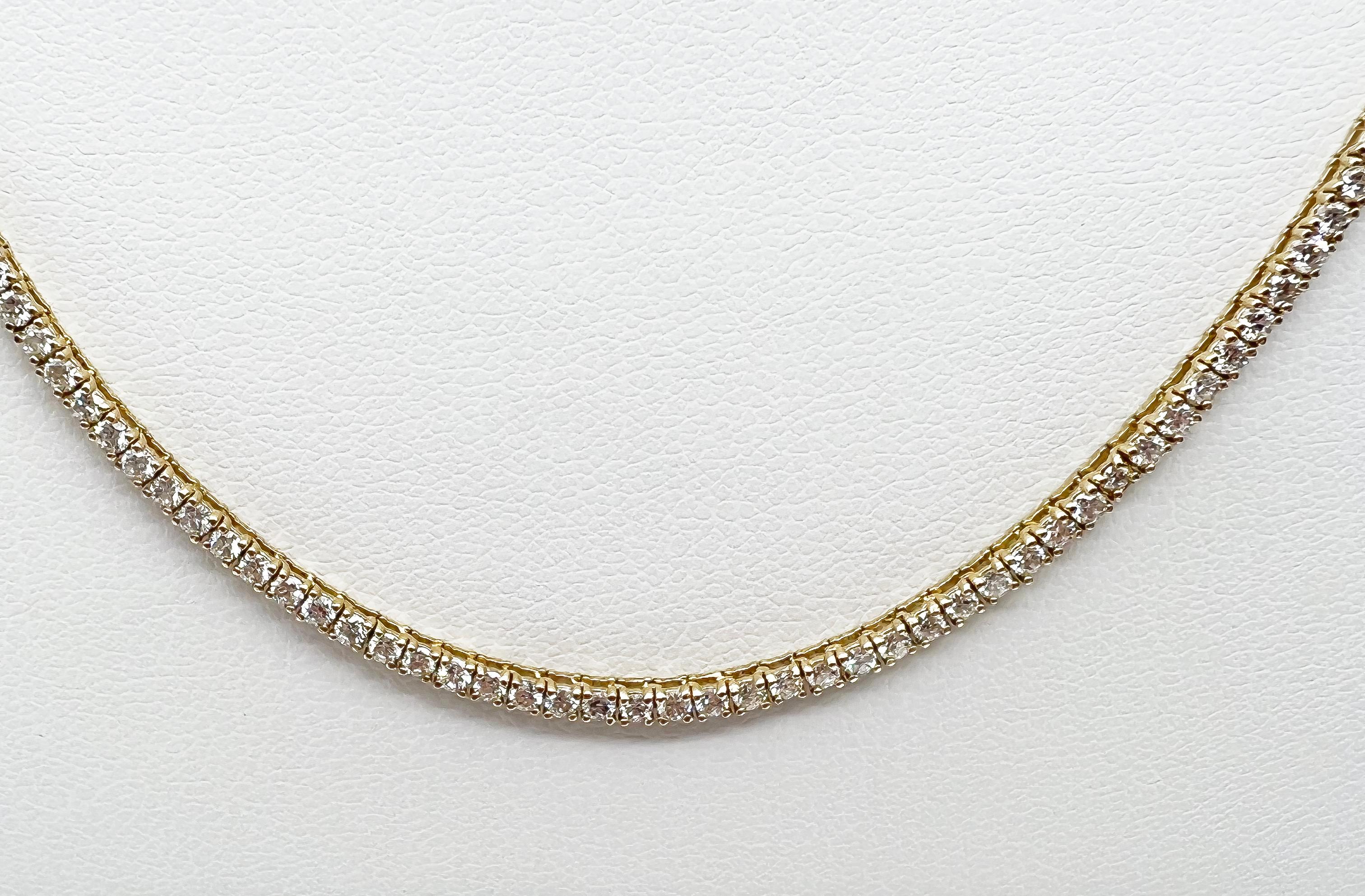 4.17 Carat Diamond Tennis Necklace with Round Diamonds in Yellow Gold Chain

Tennis necklaces are the epitome of versatility and elegance. Here we have a classic, timeless piece that you could wear it everyday or only on occasions, alone or paired