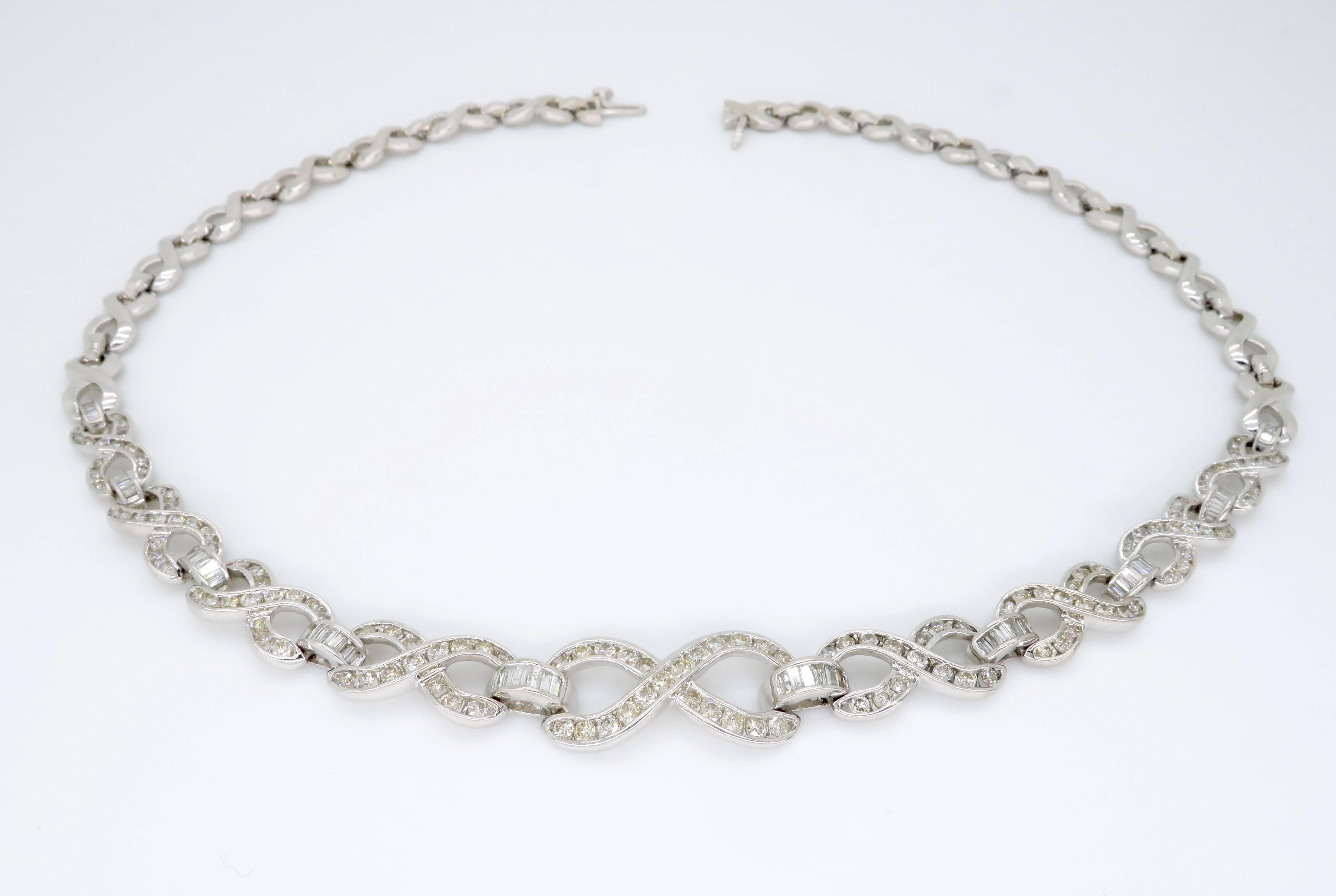 Infinity style diamond link necklace made with one hundred and ninety diamonds. 

134 Round Brilliant cut diamonds
56 Tapered Baguette cut diamonds
Approx. 4.75ctw diamond carat weight 
Average G-J color 
Average SI-I clarity 
16