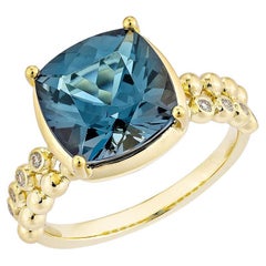 4.75 Carat London Blue Topaz Fancy Ring in 18KYG with White Diamond.