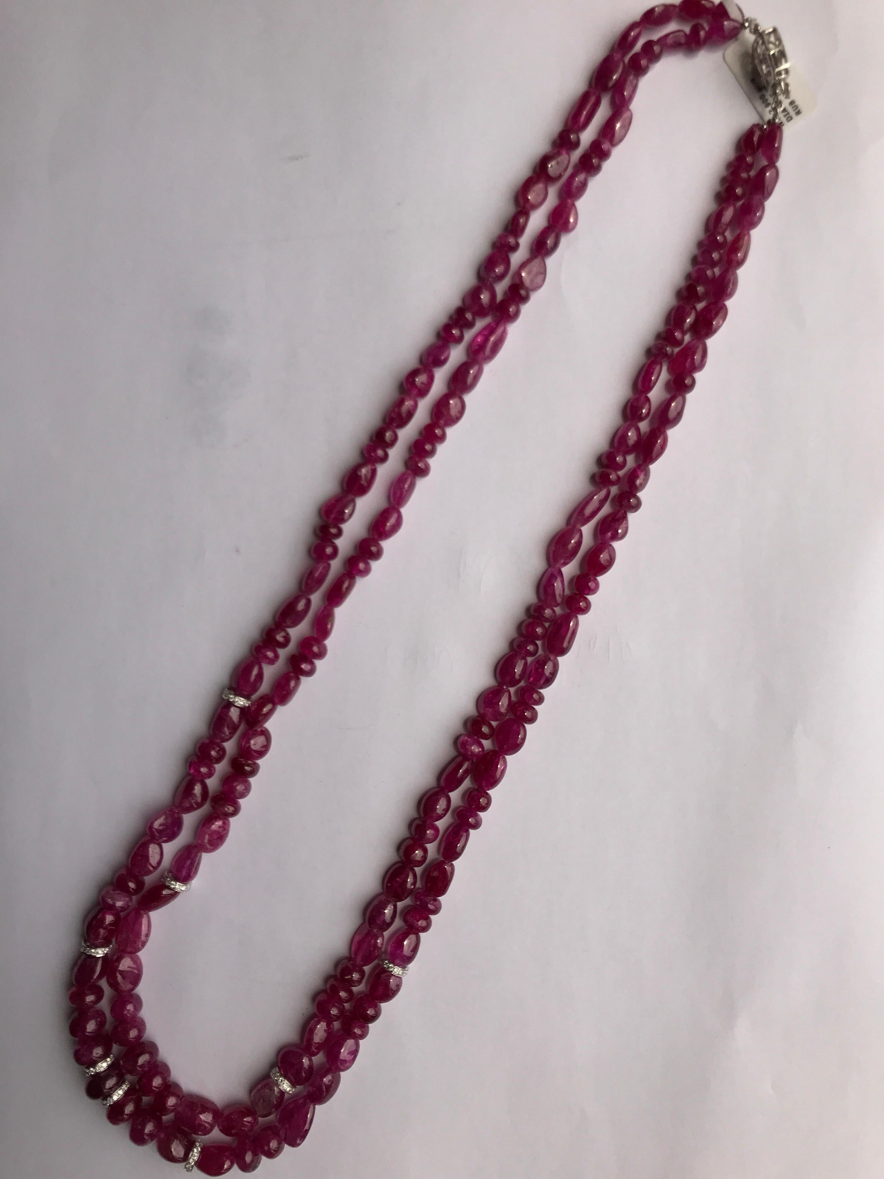 A rare multi strand necklace, consisting of 475.18 carats tumble shaped natural Burma Ruby beads. Without any kind of enhancement (heated/treated). The look of the beads is enhanced by adding gold and diamond rondelle spacers. Certificate can be