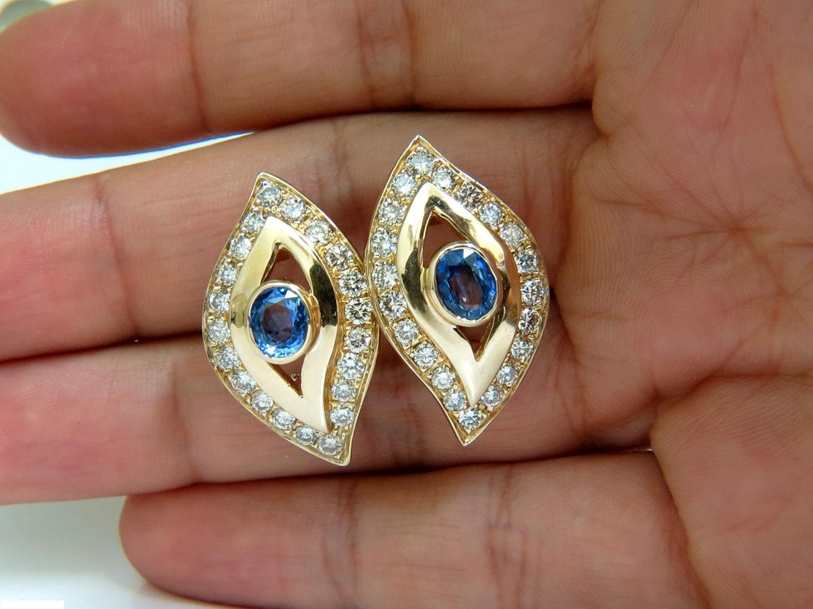 Glamour Revisted

2.00ct. Natural Sapphires

Clean clarity, full oval cuts and transparent.

Gorgeous Cornflower blues



Diamonds: 2.75ct.

full cut rounds

 I-J color 

 Vs-2 Si-1 clarity.

14KT yellow gold.

14 grams

Comfortable omega