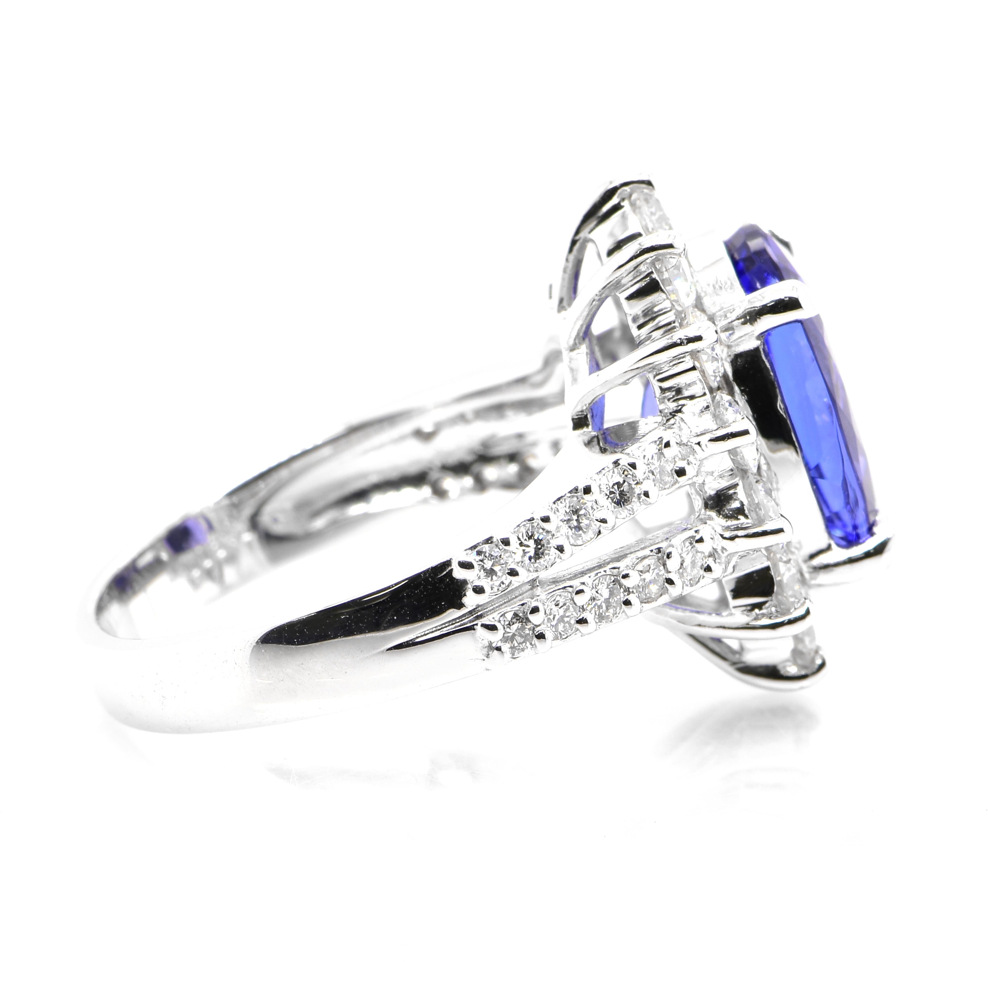 A beautiful ring featuring a 4.75 Carat Natural Tanzanite and 1.40 Carats Diamond Accents set in Platinum. Tanzanite's name was given by Tiffany and Co after its only known source: Tanzania. Tanzanite displays beautiful pleochroic colors meaning