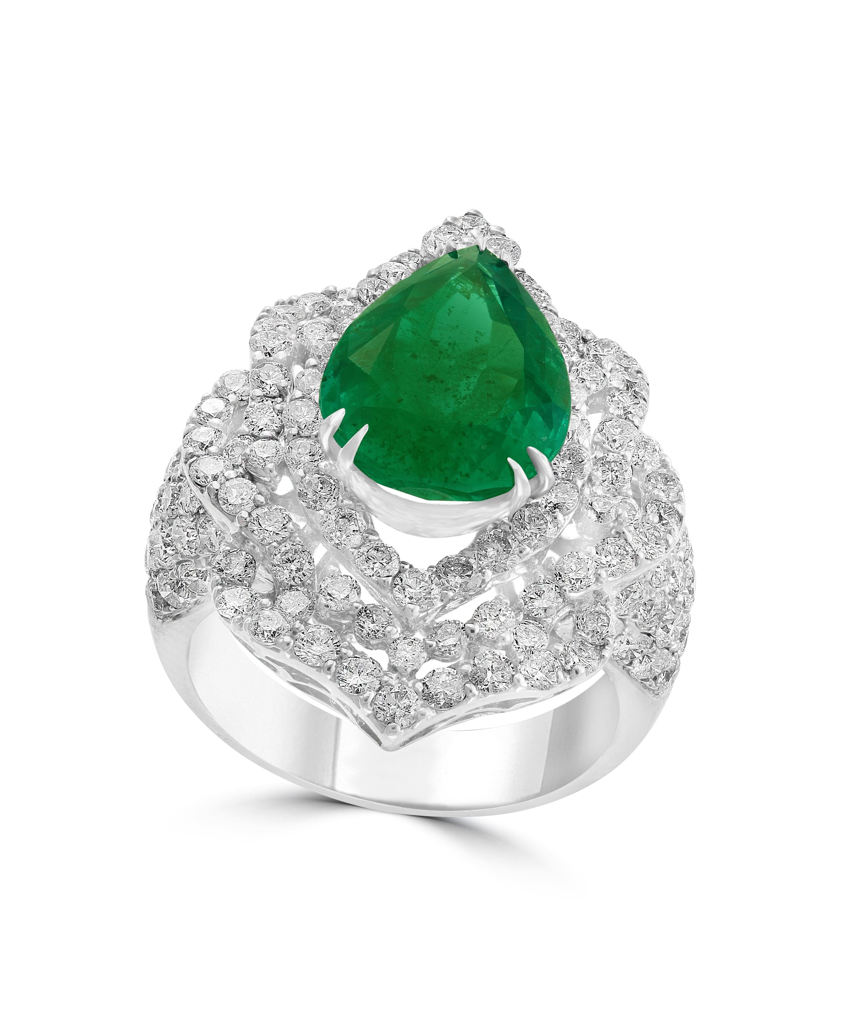 This classic Cocktail ring is a true masterpiece, featuring a breathtaking 4.75 Carat Colombian Emerald that is set in 18 Karat white gold. The estate ring is one of our finest pieces, with no color enhancement to ensure that the natural beauty of